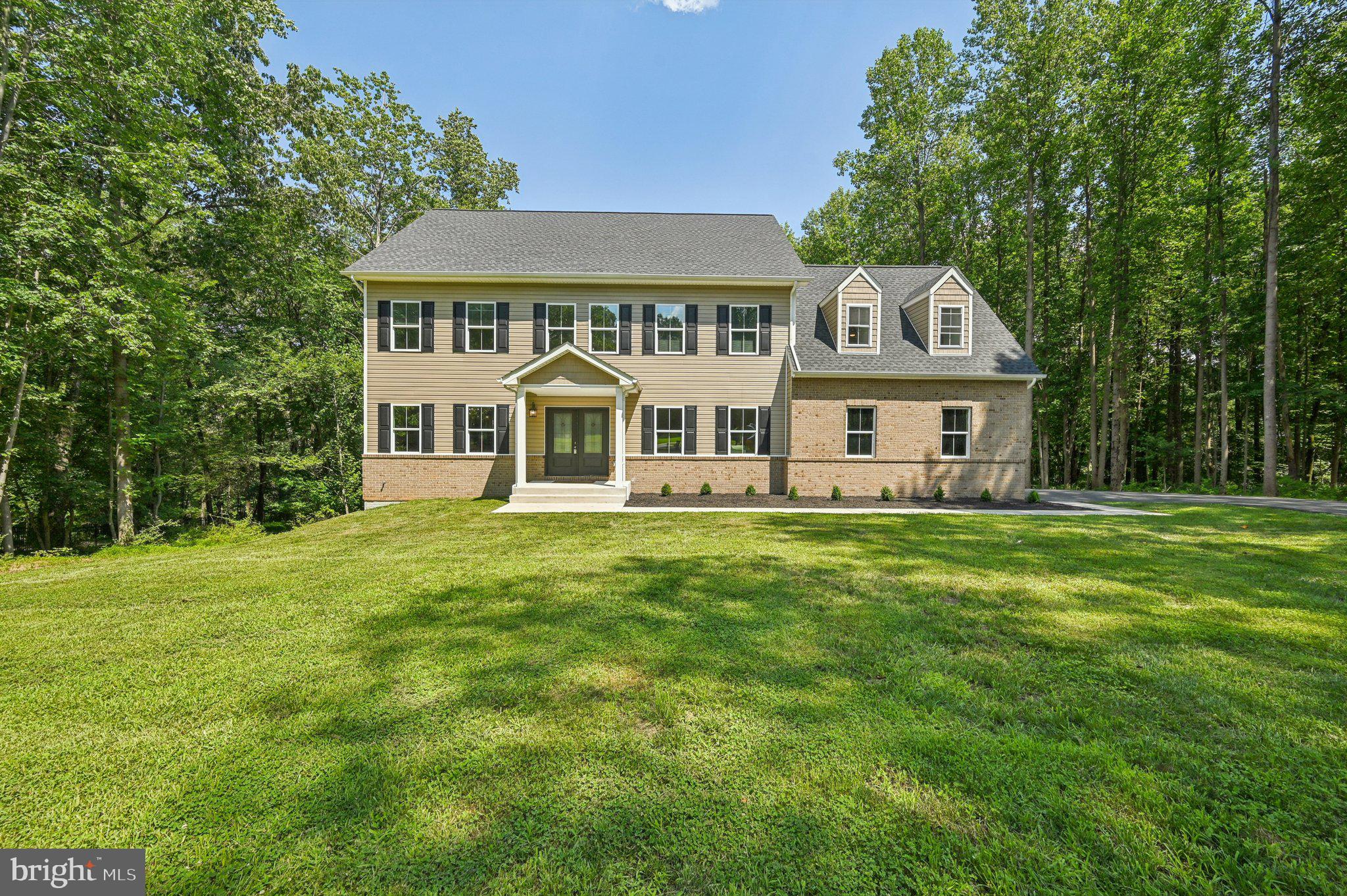 Welcome to 305 Red Meadows Court! Tucked away on a private 3.47-acre lot, this expansive one year young 6 bedroom 4.5 bath residence offers over 6,000 square feet of well-designed living space perfect for large households, hosting guests, or simply spreading out in comfort. With six spacious bedrooms and four and a half bathrooms, there’s room for everyone—and then some. The heart of the home is a large gourmet kitchen equipped with stainless-steel appliances, perfect for cooking up weeknight dinners or holiday feasts. The open flow of hardwood floors throughout the main living areas adds warmth and character, while large windows bring in plenty of natural light. Whether you're unwinding in the cozy media room, sweating it out in the private home gym, or enjoying peaceful views of the surrounding trees, each space is designed with both function and relaxation in mind. The primary bedroom offers a peaceful retreat with ample square footage and a well-appointed en suite bath. Additional bedrooms provide flexibility for office space, guest rooms, or hobby areas. Smart layout choices make this home practical for everyday living, with added extras to elevate your lifestyle. Located just minutes from shops, schools, parks, and even a local restaurants, convenience is always close by—but not too close. After all, when your backyard feels like your own private park, it's nice to have the best of both worlds. If life had a “space upgrade” button, this would be it. Schedule your showing and come see what it’s like to live with room to breathe.