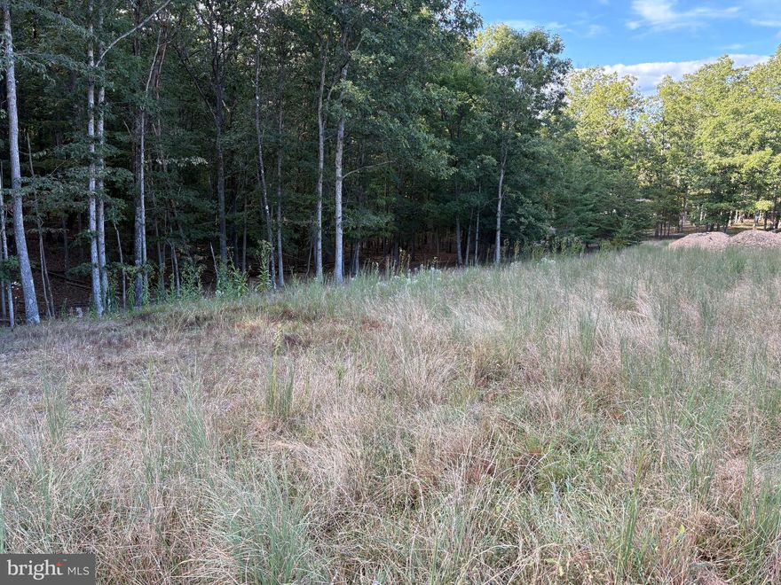 The building process has already started for you.  Come check out this lot in a very nice subdivision south of Berkeley Springs.  Easy commute to Winchester Virginia. The well has already been installed and the permit to install a standard septic system has been obtained from the Morgan-Berkeley County health dept.  This nice lot sits close to the end of Bear Paw Drive and is surrounded by a few lovely homes.