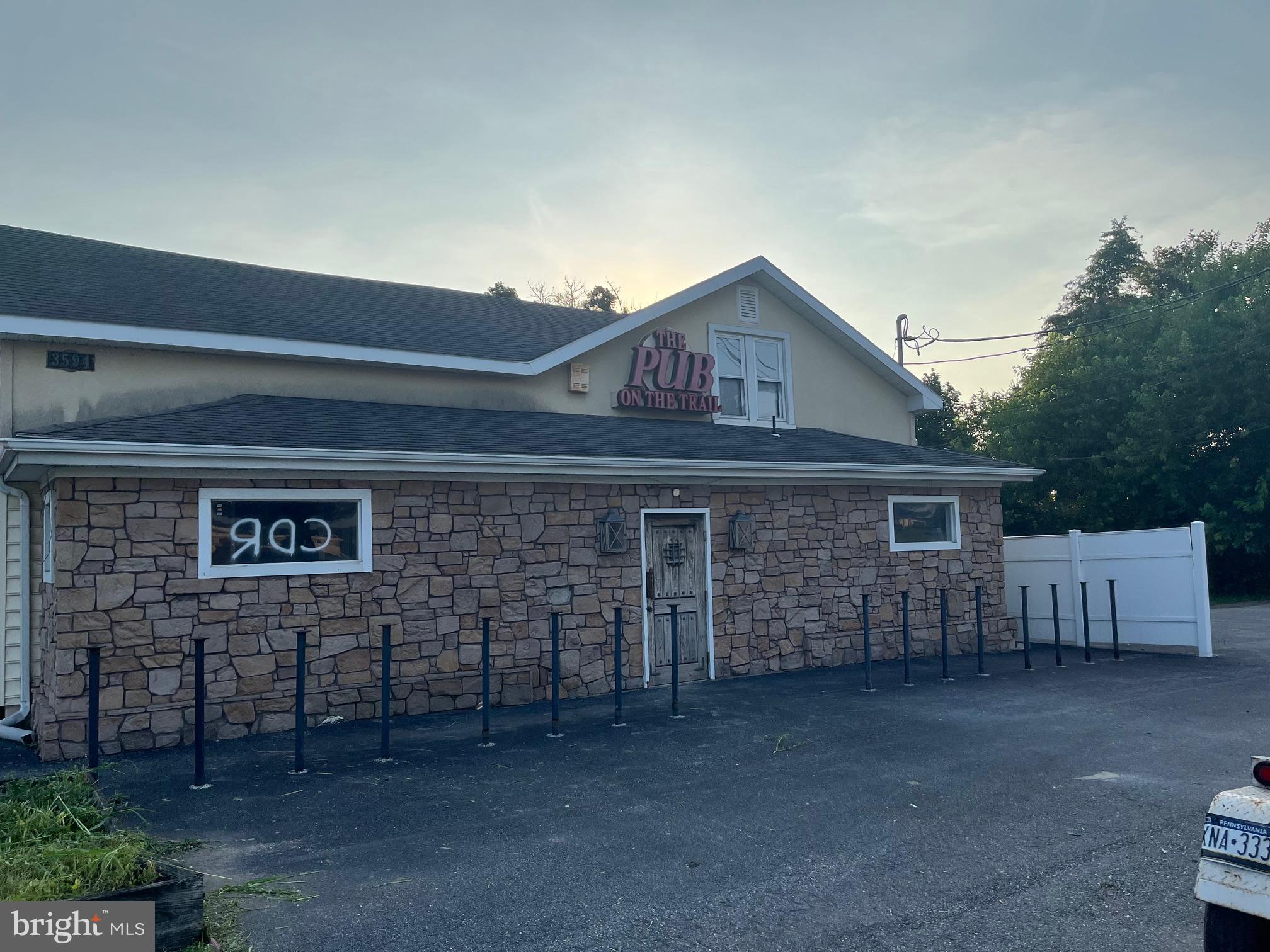 Formerly known as the "Pub on the Trail." This commercial property, previously a thriving restaurant/bar, presents an exceptional opportunity for renovation and revitalization with its abundant potential. Featuring a recently renovated 3-bedroom, 1-bathroom apartment upstairs, large 1,152 detached building ideal for storage, brew operations, or expansion. 4,600 sqft of parking area provides versatility for various ventures or outdoor recreation. Centrally located just off Route 83, this property enjoys convenient access to major routes and nearby attractions such as the picturesque Rocky Ridge County Park, inviting residents and visitors alike to explore its scenic trails and recreational amenities. Don't miss out on this chance to breathe new life into this promising property and make it a focal point of the community once again.