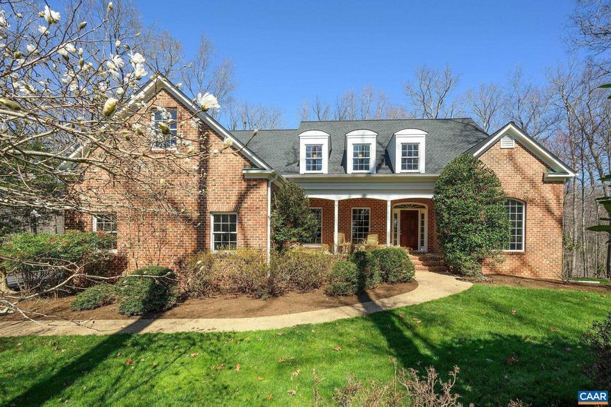 This expansive Ivy home, pristinely maintained, has a super blend of open & private spaces for great flexibility & flow. A welcoming, traditional brick facade belies an updated interior vibe for a quietly impressive home with no pretension.The main level has a formal living & dining rooms, family room w/vaulted ceilings, built-ins & fireplace & overlooks a new deck & sunny backyard. No homes in sight to the rear: the owners enjoy hiking the woods to the Mechums River. The generous kitchen is truly at the center of the home w/oodles of cabinetry, counter space, walk-in pantry & oversized breakfast area. Off the kitchen is a sunroom (ideal for playroom or home office). A back hall leads to additional closets, laundry room, back stairs, garage & side entry. The main level primary suite is tucked away & the spa-like bath is in a quiet corner overlooking the rear yard. Upstairs find 3 enormous bedrooms, all w/walk in closets, one has an en suite bathroom & the other two share a jack & jill, & a huge bonus room for teen space, play/craft/gym: whatever you need! Finally, 2500+ sf of unfinished basement w/rough-in bath is ALL potential: dream away!  Minutes to Ivy Elem, Rt 250 or Barracks Road for the drive into Cville or Crozet.,Granite Counter,Painted Cabinets,Fireplace in Family Room