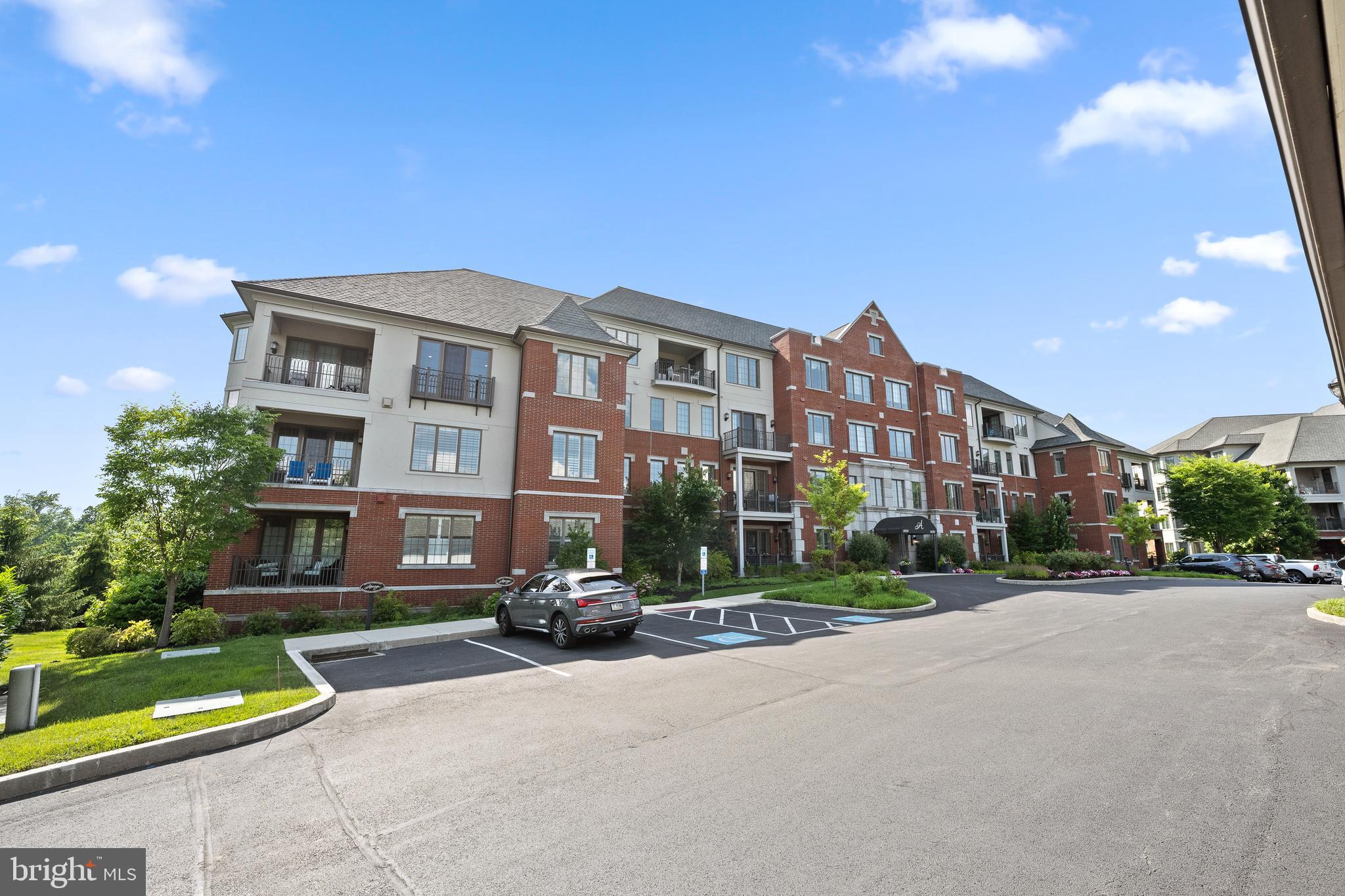 Enjoy maintenance-free living in this beautifully appointed condo located in the sought-after Haverford Reserve. Perched on the 3rd floor, this home offers sweeping wooded views from every room and a spacious private terrace- one of the largest in the community—perfect for relaxing or entertaining. The open main living space is filled with natural light thanks so a stretch of five oversized windows. The cozy gas fireplace, creates a warm and inviting atmosphere. The kitchen shines with marble backsplash, custom cabinetry, and stainless steel appliances, all under 9’ ceilings that enhance the airy layout. The generous primary suite includes walk-in closets and a luxurious ensuite bath. A versatile interior den, adjacent to a full bath, easily functions as a 2nd bedroom , home office, studio, flex space or whatever you might need! Additional highlights include full-size laundry, abundant closet space, and the feel of new construction—this home is only 7 years old and impeccably maintained. Don’t miss this rare opportunity to live in one of the area’s most desirable communities! Athertyn is the centerpiece of Haverford Reserve, a 209-acre residential & preservation development complete with nature & biking trails. Residents enjoy the use of a clubhouse, pool & spa, tennis court, putting green & gardens. Situated in a parkside setting, it's less than 2 miles from the Haverford Train Station and offers all the conveniences of the Main Line. Condo also includes 1 parking space (#32) and storage space (#25) in underground garage.