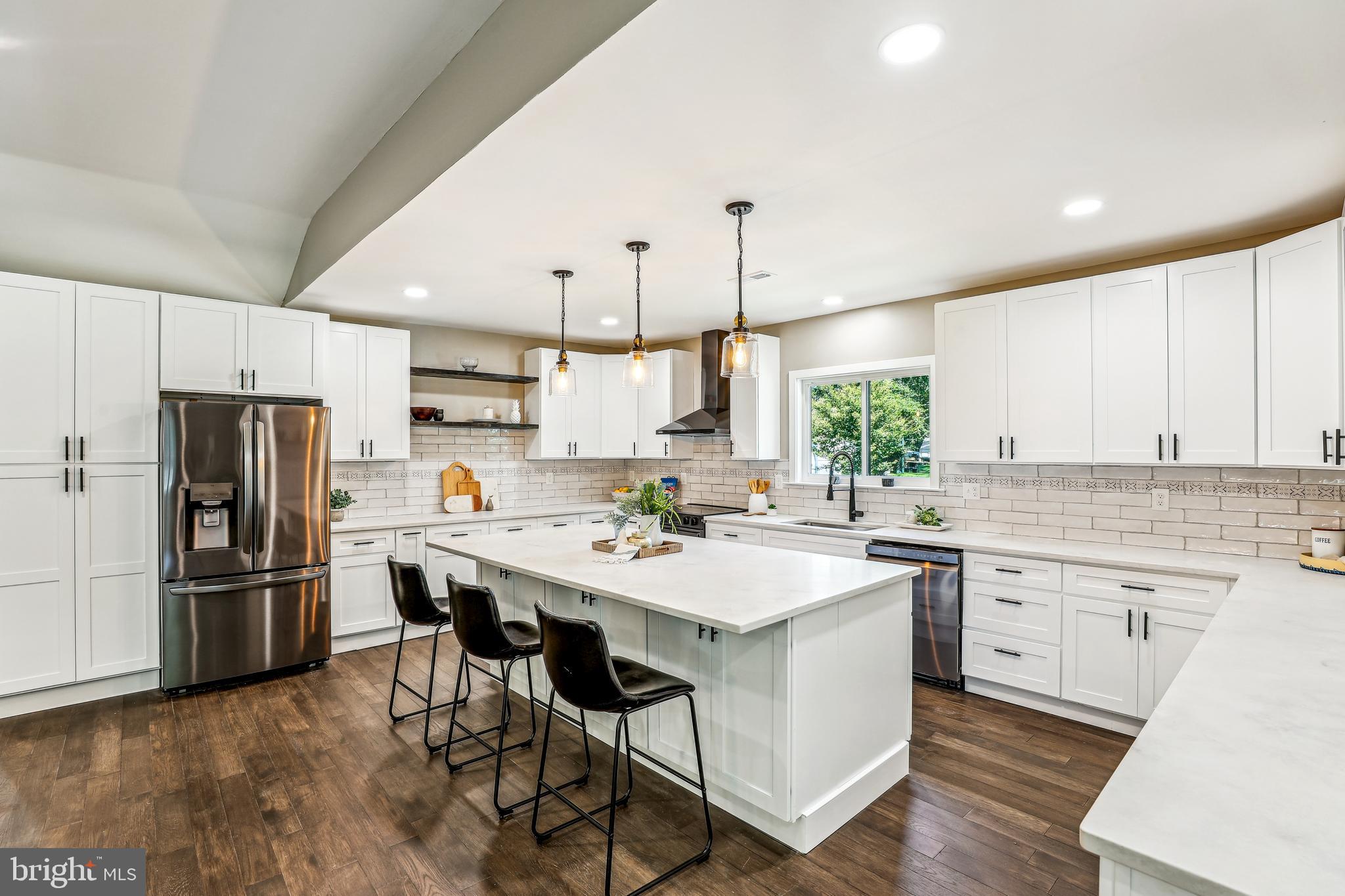 Completely Rebuilt 3,750 Sq Ft Rancher in Long Point on the Magothy!
This stunning home is brand new from the foundation up, featuring a new BAT septic system, upgraded underground BGE service, and all-new mechanical, electrical, and plumbing systems. With a one-of-a-kind design and custom details throughout, this property is truly a rare find.
Step inside through the charming screened-in front porch or the convenient back entrance into the mudroom with built-in bench. The main living area boasts an open-concept layout perfect for entertaining, highlighted by a chef’s kitchen with a large island, quartz countertops, black stainless steel appliances, and ample cabinetry. The adjacent dining area features a built-in wet bar with a sink and wine fridge, flowing into a cozy entertainment room with an electric fireplace.
Offering 4 bedrooms plus a flexible office space that could serve as a 5th bedroom, the layout provides versatility for any lifestyle. The luxurious primary suite includes a walk-in closet and spa-like bath with soaking tub, walk-in shower, and double vanity.
Enjoy the ease of one-level living and endless outdoor possibilities on the large corner lot. Relax on the expansive deck, entertain on the front porch, or enjoy the spacious front and backyard.
All this in the sought-after water-privileged community of Long Point on the Magothy— don’t miss your chance to own this extraordinary home!