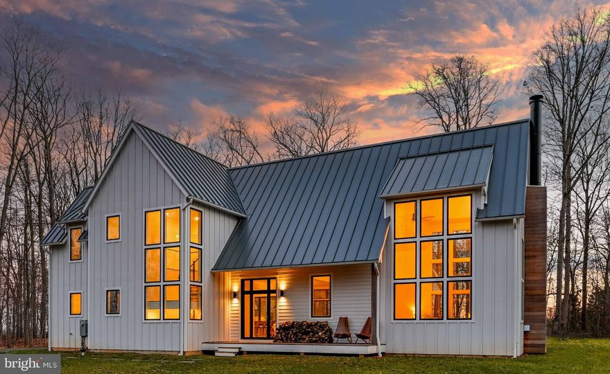 Live authentically. Exquisite workmanship and masterful design harmoniously come together in coveted Upperco. Peacefully nestled on 13.63 acres of delightful seclusion, this newly-built modern farmhouse boasts a thoughtful and innovative living experience. Geothermal heating and cooling. Walls of glass invite boundless sunlight and serene views of the outdoors. Gleaming hardwoods are made from trees native to the property. Enjoy a sensational gourmet cooking space with double islands, chic hardware, stainless steal appliances and windows that slide open to a beautiful hardwood deck. A perfect gathering place. Grill al fresco under the stars. Breathe deeply and explore the land around you. Open concept first floor creates seamless flow to the family room with vaulted ceilings and an impressive wood-burning fireplace. Incredibly designed mudroom with functional space and exterior access. Expansive second floor loft can be used to work, lounge or play. Countless possibilities. Bedrooms are bright and light. Luxuriate in the primary bath with dual vanities and oversized shower. Lower level is partially finished with ample space and opportunity. House was prepared to allow for a first floor and garage addition. See attached designs by Kimmel Studio Architects. Potential for accessory structure to be built on property. Buyer to confirm. Convenient location close to shopping, schools and 83. A masterpiece not to be missed. The art of uniting human and home.
PLEASE DO NOT GO ONTO PROPERTY WITHOUT A CONFIRMED APPOINTMENT.