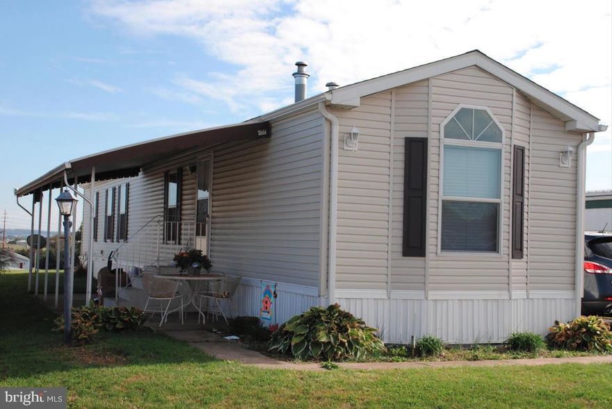 Energy Star rated singlewide offers low energy costs. 2009 PINE GROVE 14x72, MDL GH-577 with covered patio. Metal outdoor table & chairs stay. Two beds/two baths at opposite ends of the home. All appliances stay. Insulated tilt windows with screens. Walk-in shower! 6x4 walk-in closet! Breakfast Bar! 2 indoor pets under 30 lbs allowed. See 25 photos! MOVE IN QUICK!