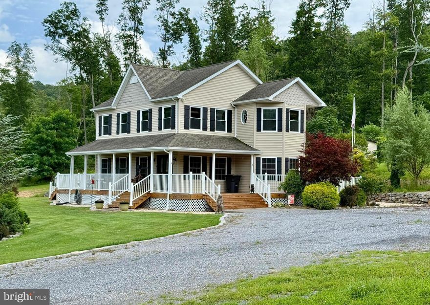 Nestled in a serene countryside setting, this beautiful property offers the perfect blend of comfort, space and rural charm.  The centerpiece is a spacious two story farmhouse with a 360 degree, wrap around porch-ideal for relaxing and enjoying the tranquil surroundings.  The gently rolling unrestricted, 8 acres includes lush open fields and a peaceful wooded backdrop, along with a scenic pond near the edge of the forest-creating a truly picturesque retreat.  

Step inside to a world of warmth and elegance in this exquisite 2050+/- sq. ft. home, where every detail has been thoughtfully crafted to elevate your living experience. The heart of this home is undoubtedly the gourmet kitchen, a culinary enthusiast's dream come true. Rich, honey-toned wooden cabinets stretch from floor to ceiling, providing ample storage and exuding a timeless charm. The sleek stainless-steel appliances, including a built-in microwave and modern range, offer both style and functionality. A stunning backsplash adds a touch of sophistication, while the gleaming floors tie the space together beautifully.

As you move through the home, you'll discover a harmonious blend of comfort and style in every room. The living areas are bathed in natural light, creating an inviting atmosphere perfect for both relaxation and entertaining with a stone gas fireplace being the focal.  Ceiling fans throughout ensure year-round comfort, while the carefully chosen decor adds personality and warmth to each space.

The bedrooms are sanctuaries of tranquility.  The oversized primary bedroom includes a setting/gym/office space.  Completing this area is a walk-in closet & primary bath.  Ample windows offer serene views and fill the rooms with soft, natural light. The bathrooms are modern oases, featuring stylish vanities, ample storage, and unique design elements like the striking accent wall that adds a touch of luxury to your daily routine.

One of the home's most charming features is its welcoming entryway. A beautiful stained glass door creates a stunning first impression, while the combination of beautiful floors and large windows sets the tone for the warmth that permeates throughout the house.

With three bedrooms, three bathrooms, and additional spaces like an office and laundry room, this home offers the perfect balance of shared and private areas. The open concept living and dining area is ideal for hosting gatherings, while the separate rooms provide quiet retreats when needed.

Plenty of storage space is found in the floored attic accessed by stationery steps. 

Step outside to a landscaped yard featuring a custom-built fire pit, perfect for entertaining under the stars.

Complementing the home is a 40' x 40',  well maintained detached metal garage with dual garage doors, offering abundant space for a workshop, storage or a hobby area.  A full house generator will convey.

Located at 1809 Caldwell Hollow Rd in the picturesque setting this property offers not just a home, but a lifestyle. Imagine waking up each morning in this beautifully appointed space, ready to embrace all that life has to offer. This isn't just a house - it's the canvas upon which you'll paint the memories of a lifetime.  Whether you're looking for a full-time residence, a family getaway, or a place to build your dream lifestyle, this property delivers space, functionality, and natural beauty in equal measure.