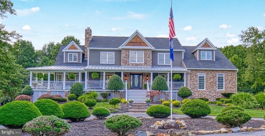 An unprecedented opportunity awaits within walking distance to the Historic Town of Clifton. This custom-designed 5 Bedroom, 5 Bath home has over 6,000 square feet of comfortable living on 7 flat acres in desirable Glencairn, yet just a short stroll into town. The magnificent drive to the home shows off its beautiful stone exterior with a grand walk and stairs leading up to the expansive wrap around front porch with several outdoor entertaining areas. As you enter the foyer, you are greeted with high ceilings and an abundance of light from the large windows and glass doorways connecting the Dining and Living Rooms to the spacious Sunroom leading back out to the wrap around porch. The recently updated gourmet Kitchen boasts pristine 42” cabinetry, gleaming granite countertops and quality stainless steel appliances. Step down into the grand Family Room with over-sized windows, impressive floor-to-ceiling stone wood-burning fireplace, and two doors leading to the deck providing scenic views of the extensive landscape and pool. An Office with built-ins, powder room and laundry/mud room complete the main level. The upper level boasts a spacious Master Bedroom suite with high ceilings and his and hers connecting walk-in closets. Freshly updated, the spa-like Bath has dual vanities, a free-standing soaking tub and frameless glass shower. Down the hall are three large Bedrooms with plenty of closet space. Two of the rooms share an over-sized Bath with connecting hallway for additional privacy. The lower level completes this home with a 5th Bedroom with private entrance, a Full Bath, wet bar, and Recreation Room with direct access to the pool. The serene backyard has it all with an in-ground swimming pool, picturesque screened gazebo, outdoor shower, country style barn and two separate fire-pit seating areas overlooking the Clifton Creek and bordered by Clifton Town 8 Acre Park and its walking trails. Incredible location just a mere walk to the Historic Town of Clifton and its restaurants and shops.