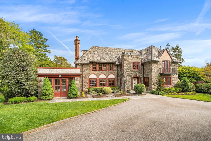 Set on one of Bryn Mawr’s most picturesque streets, this quintessential Main Line residence blends timeless architecture with exceptional care and beautifully curated grounds. Wrapped in exquisite stonework and crowned by a classic slate roof, the Tudor home exudes warmth, character, and enduring elegance from the moment you arrive.
Inside, gracious living spaces are filled with natural light, rich architectural detail, and a seamless flow ideal for both everyday living and entertaining. Oversized windows frame beautiful views of the blooming grounds, while inviting interior spaces offer warmth, comfort, and timeless appeal.
Walk through the signature covered front door entry into a breathtaking reception hall, where a grand soaring staircase sets the tone for the timeless elegance found throughout the home. A formal living and dining space create a warm and welcoming flow ideal for both everyday living and entertaining, while a beautiful Mercer tile sun room bathed in natural light offers a peaceful space to enjoy morning coffee or relaxed evenings overlooking the beautifully landscaped grounds. A handsome office with custom built-ins offers the perfect work-from-home retreat.
The beautifully equipped eat-in kitchen blends timeless style with exceptional functionality, featuring a Sub-Zero refrigerator, beverage center, large center island with Viking cooktop, double wall ovens, Bosch dishwasher, two pantries, white cabinetry, and granite countertops. A powder room discreetly tucked beneath the staircase completes the first floor. 
Upstairs, the second floor hosts a luxurious primary suite with a marble bath. Beyond the bath, a private dressing room showcases incredible custom built-ins, generous closet space, and a desk area. Two additional bedrooms share a Jack-and-Jill bath, while a spacious rear room offers flexibility as a den, office, or lounge space. Also on this level are the laundry area, a playroom, and a nursery. A convenient rear staircase leads directly back to the kitchen. 
The third floor offers two additional bedrooms connected by a hall bath, along with an enormous cedar closet providing exceptional storage. 
The finished lower level expands the home’s versatility with a spacious family room, separate bedroom, full bath, and abundant storage — ideal for guests, an au pair suite, or extended family living.
In the spring and summer months, the property truly comes alive with lush, mature landscaping and vibrant gardens that create a storybook setting. Thoughtfully maintained and lovingly cared for, the home offers the rare combination of classic Main Line charm and true pride of ownership.
The home and grounds have been impeccably maintained allowing the next owner to move in with confidence. A rare opportunity to own an iconic Bryn Mawr property that captures the very essence of Main Line living — timeless, elegant, and beautifully cared for, all in a walkable neighborhood in award winning Lower Merion School District, minutes from shopping, dining, entertainment, and public transportation. This house is not to be missed!

Please note: Interior Photos will be added on Thursday. All square footage to be confirmed by buyer.

Exclusions: Entryway mirror. Appliances are included in as-is condition.