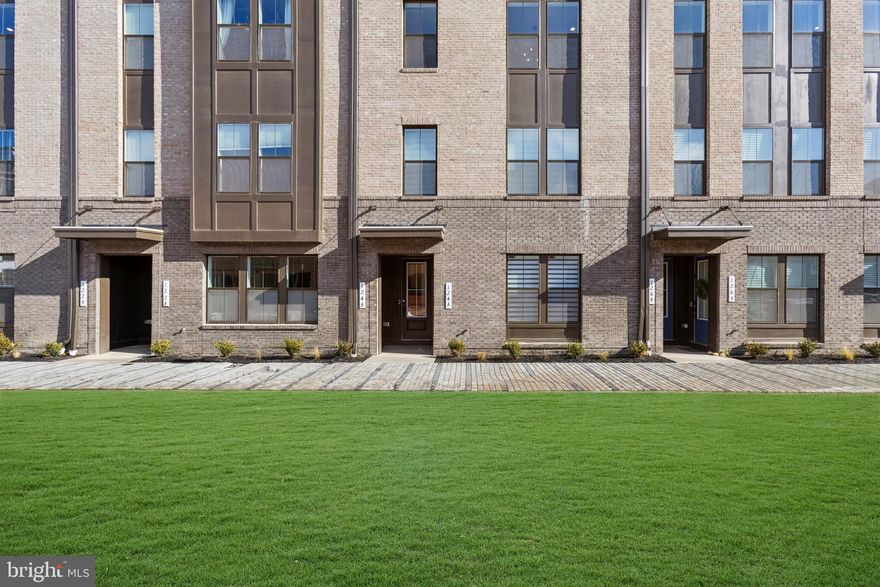 FINAL OPPORTUNITIES!!!This  conveniently-located home features some near-perfect features, including a kitchen with island and pendants above, pantry, upgrade cabinets, quartz countertops, ceramic backsplash and stainless steel appliances.  The over-sized great room opens to a large covered balcony; plus engineered wood flooring throughout main level living areas as well as the bedrooms and upper hallway. The upper level includes three sizeable bedrooms, a loft area, and an upper laundry room including washer and dryer; plus a primary bedroom with TWO walk-in closets and adjoining bath with two vanities and walk-in shower with seat -- including upgrade ceramic tile and quartz countertops.  Stairs lead to the extra large roof-top terrace that is perfect for star gazing or just soaking up a little extra sunshine.***  Locke Landing offers the vision, the lifestyle, and the water you’ve been yearning for. In the heart of the Baltimore Peninsula, K. Hovnanian’s new 2-story condominiums overlook 2.5 miles of restored waterfront.