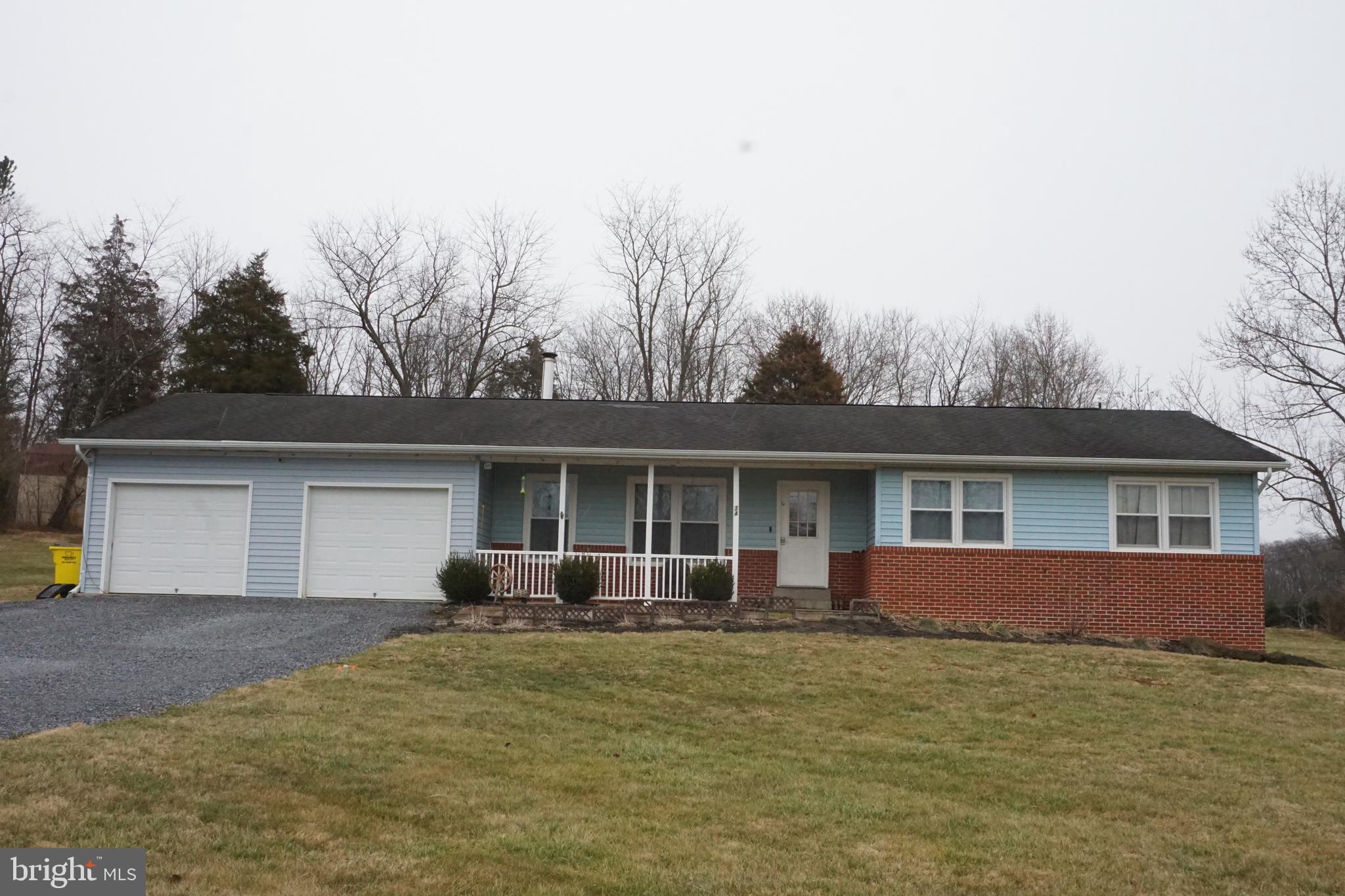 Welcome to your new home, you will be close to everything, but makes you feel like you are in the country. This home is close to Amazon, P&G company, Clorox and Cat liter plant, easy commute to I-81, RT 11 to Virginia, or Maryland. This home has so much to offer, they have updated so much. Some new flooring and there is no carpet in this home. A new french door on the back, that leads to a 16X 30 wooden patio, for a nice relaxing evening. Primary bedroom has a 5x11walkin closet, with a updated bathroom. 2 car garage, with a door to walk outside. Seller's have enlarged to laundry room to make it bigger for your utilities. They had added a wood stove to keep you warm in the winter.