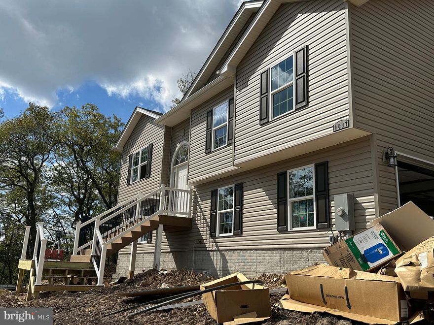 Nearing Completion within 30 days! Top of the world views! Private.  Over 1/2 acre  lot private, stunning views of valley and mountains.  Side load garage with garage windows across front.  3 bed, 3 full baths, 2 car garage, open floor plan, family rm and kitchen with vault. HW floors entire main floor and stairs, tile floors in all baths, upgraded cabinets.  BUILDER BONUS HARDWOOD IN BEDROOMS, BUILDER BONUS GRANITE IN KITCHEN, BUILDER BONUS KITCHEN ISLAND, FINISHED REC ROOM (1,850 SQ FT-BIGGEST BANG FOR YOUR BUCK FOR SQ FT) UPGRADED LVP FLOORING IN REC ROOM and upgraded cabinets. 1619 and 1617 to have shared PAVED driveway.