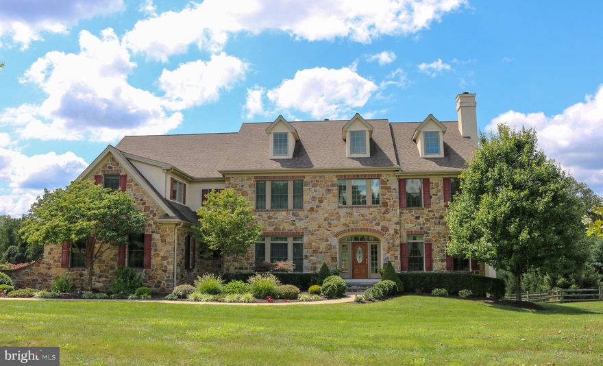 Impeccable sun-filled home on premier home site in the executive community of Parker Preserve, located in award winning Unionville Chadds Ford School District. One walk through this wonderful home and you will not want to leave! Attention to detail at every turn. The main living area of this home oozes with comfort and quality. Heavy cased arched openings, columns, wainscoting, site finished hardwood flooring, built-ins, crown molding and chair rail, all with the finest in detail. Excellent space for entertaining--guests can easily roam from room to room and access privately situated deck from multiple rooms. High quality custom painting and tasteful wallpaper throughout. The chef's kitchen features ageless natural cherry cabinetry, a 10' center island, Wolf gas cooktop, double wall oven, microwave, two Bosch dishwashers, main sink and island sink, pot filler, custom back splash, and Sub-Zero side-by-side full size refrigerator and freezer. The kitchen opens to the breakfast and family rooms. The breakfast area floods with natural sunlight and has access to the back deck area. The family room features a cathedral ceiling and stone floor-to-ceiling fireplace with raised hearth. Upstairs, the quiet master suite is situated separately away from the other bedrooms and features an 11' tray ceiling, walk-in closet organized by Closets By Design, and a private sitting area with fireplace and built-ins. The MBTH features custom tile walk-in shower with dual shower heads,  corner jetted tub and custom cherry vanity with granite tops. The secondary bedrooms are all very spacious and enjoy closet organizers and access to private tile baths. There is a full walk-up attic accessed off the hallway. The lower level is finished and is basically a home away from home. It features a 1000 square foot family room, full tile bath, and two private rooms currently used for a music room and finished storage. The lower level also features a pool kitchen with tile floor and an outside entrance to your backyard oasis. Custom designed heated pool with built-in spa, stone walls and stairs, professional landscaping, fencing, a level and private backyard. Don't forget the handheld remote so you can control the pool, spa lights, waterfall, spa heat and blower so it is ready and warm when you are! All of this in a fabulous walking neighborhood conveniently located to 202 and 52 with easy commute to Wilmington and Philadelphia, and minutes away from Longwood Gardens, shopping and schools.