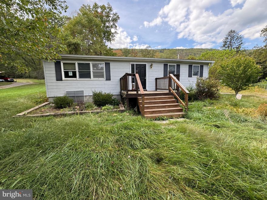 Spacious ranch-style home offering over 2,000 square feet of one-level living on nearly a half-acre in Hampshire County. The layout includes a large family room, country kitchen with adjoining breakfast area, and several flexible rooms that may serve as bedrooms, office, or hobby space. Hardwood floors, vaulted ceilings, and skylights add light and character throughout.

A detached two-car garage with an upper-level workshop and balcony, plus additional kennel space, provides plenty of utility. Convenient location with easy access to Winchester and surrounding areas. Home is being sold as-is and presents a great opportunity for the right buyer.