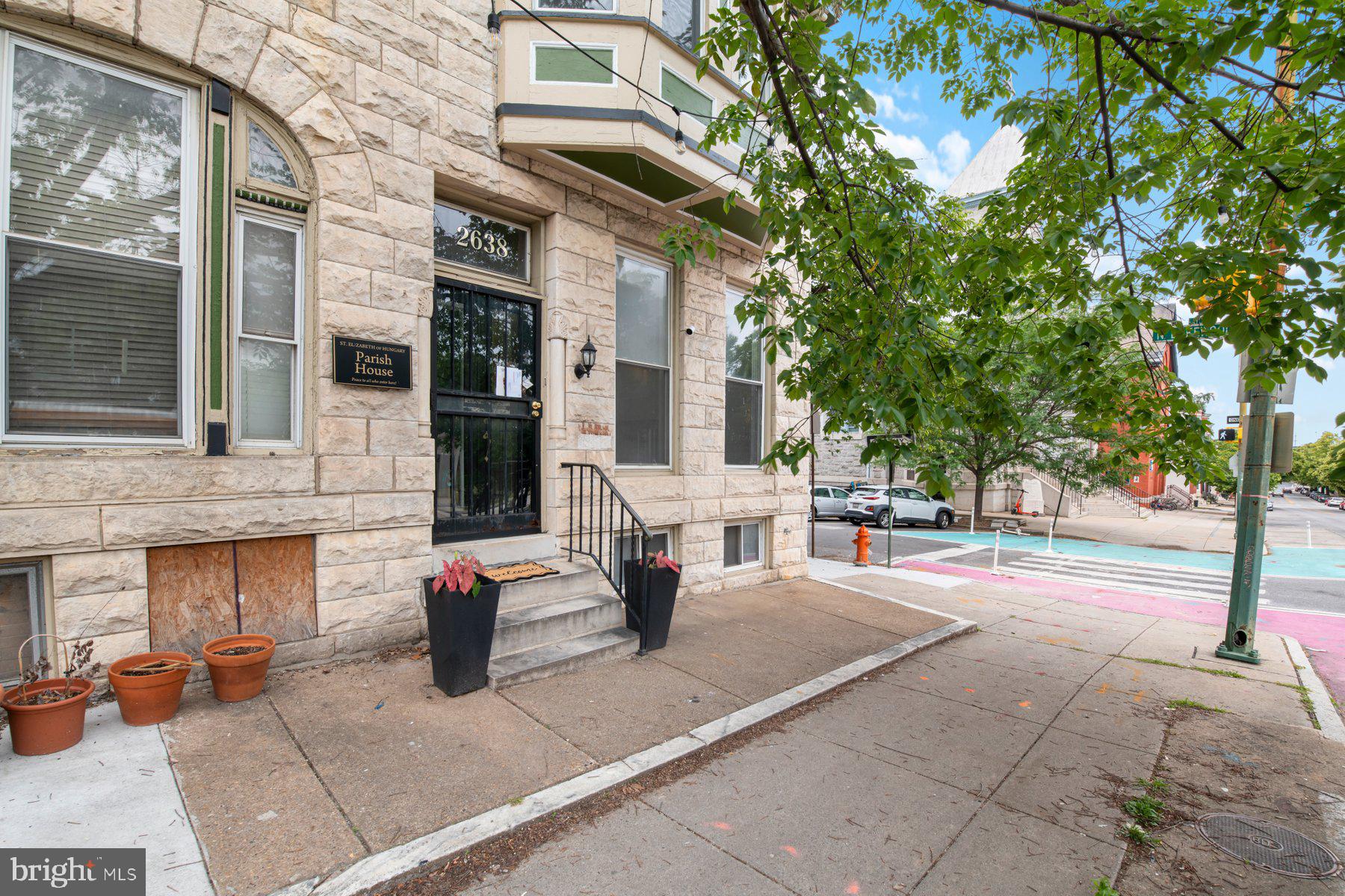 Iconic location. One of the largest homes facing Patterson Park. This is your chance to own a very special Baltimore parkfront home!
Originally built as a parish house, this architectural gem comprises almost 4,000 square feet above grade and is packed with original details: stained glass, inlaid and parquet wood floors, a traditional marble tile vestibule, original fireplace mantels, bay windows, a skylight, and vintage tilework in multiple bathrooms - it's a treasure trove of character.
The layout spans three full stories with up to nine potential bedrooms. Whether you need multiple suites, oversized walk-in closets, or creative bonus spaces for a home office, gym, playroom, or studio, there’s room to do it all. The second floor is already set up for a jaw-dropping primary suite, complete with space for a laundry room and walk-in closet.
On the main level, the opportunity is clear: create a flowing open-concept living and dining space, and transform the back room into the butler’s pantry of your dreams. The kitchen is updated and fully functional, giving you flexibility to move in now and take on potential upgrades in phases.
Downstairs, the basement adds over 1,300 square feet with a half bath, side entrance to Lakewood Avenue, and a built-in safe - you'll have tons of extremely usable space that's perfect for storage, creative use, or perhaps an apartment/Airbnb unit with its own exterior access! Out back, the garage could be converted into a covered parking pad.
The sellers have made many updates and are offering the home as-is, and the next owner will have the chance to put their own stamp on the rest of the home! The sellers' recent updates include: new interior paint (2025), all-new mini-split HVAC (2023), water heater (2022), dishwasher (2025), stove (2025), fridge (2024), and washer/dryer (2022). The elevator is not currently functional, but could be replaced using the existing shaft, or removed to reclaim additional space.
This home is a rare blend of character, space, and possibility - all right on Patterson Park with all the amenities, activities, and community opportunities that come along with this prime location! Move in, make it yours, and watch your vision come to life in one of Baltimore’s most coveted locations!