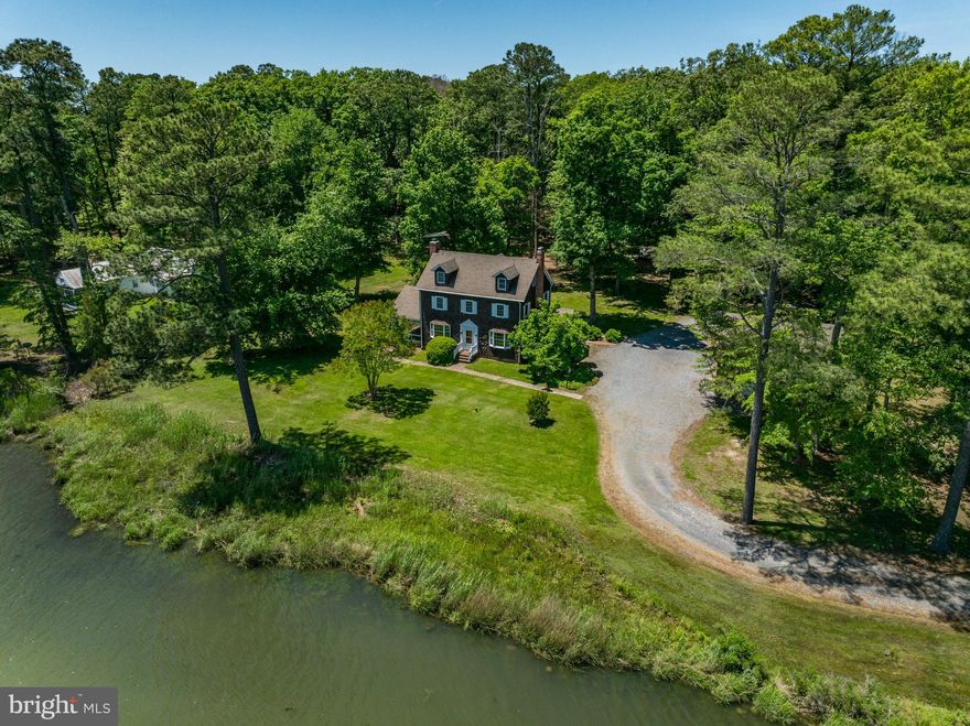 Welcome to Shady Side, an exceptional waterfront retreat on the beautiful Miles River. Built in 1920 and offering stunning waterfront views from nearly every room, this quintessential center hall Colonial features 5 bedrooms and 3 full baths over approximately 2400sf on 3 finished levels. Entertaining is a breeze with the kitchen's open layout, while ensuring you never miss out on the spectacular scenery outside. A main level primary bedroom suite is tucked away towards the rear of the home to ensure privacy, while the screened-in  porch off the living room is the perfect spot for your morning coffee or afternoon siesta! Three bedrooms and one full bath complete the 2nd level. The finished 3rd level with another full bath boasts birds-eye views of the Miles River and offers the flexibility to use the space as a 5th bedroom or recreation room. A detached 2-car garage and storage shed complete the offering on 2.64 acres with over 440 feet of direct Miles River water frontage. Less than 10 minutes from Downtown Easton and just a short boat ride (or less than 15 minutes by car) to St. Michael's, Shady Side enjoys a central location amidst the Eastern Shore's top attractions, while still offering a sense of peaceful seclusion. Note: Septic is approved for 3 bedrooms.  Please do not walk or drive down the driveway as security measures are in place. Listing agent(s) must be present for all showings.

Neighboring waterfront property (26813 Miles River Road - 1 bedroom, 1 full bath a pier on 2.43 acres) is also for sale.