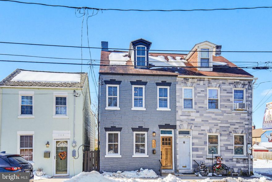 Welcome home to this beautifully updated historic semi-detached gem in Columbia — where character and modern comfort come together perfectly. From the moment you step inside, you’ll love the warmth of the exposed brick wall, stylish finishes, and easy-care luxury vinyl plank flooring throughout the main level. The bright living room with ceiling fan flows seamlessly into the dining area with updated lighting. The kitchen is thoughtfully upgraded with stainless steel appliances, tile backsplash, upgraded countertops, and plenty of space to cook and entertain. A convenient powder room with tile flooring and access to the private, fenced rear yard make the first floor both functional and welcoming. Upstairs, you’ll find three comfortable bedrooms (one with a ceiling fan) with hardwood flooring and a beautifully refreshed full bath with tile flooring. The third level offers a spacious, carpeted bonus area — perfect as a fourth bedroom, home office, or playroom. With laundry hook-ups in the basement and flexible living space throughout, this home offers charm, convenience, and versatility. Come see it for yourself  — schedule your private showing today!