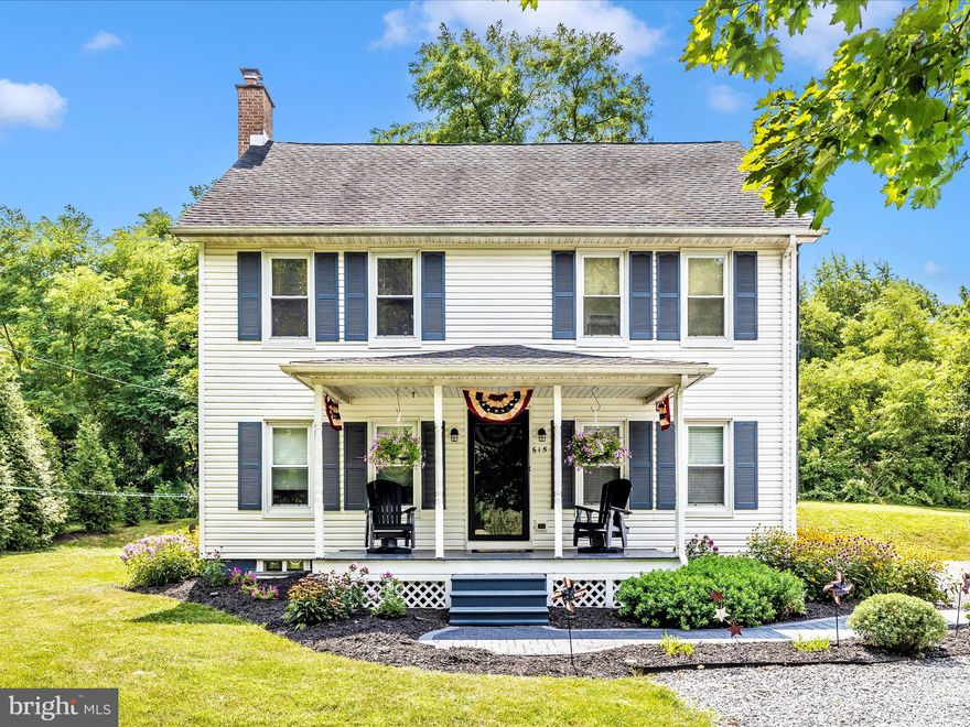 Set in a peaceful country setting, this beautifully updated vintage home offers the perfect blend of classic charm and modern convenience. Step inside to find a spacious living room filled with natural light,  and an abundance of windows. The well-equipped kitchen offers a breakfast area and  opens to a separate dining room with pellett stove—ideal for entertaining—while the main level also includes a versatile mudroom with laundry, pantry space, and a stylishly updated full bath. Charming wood accents throughout, including lovely trim and wood doors, bring warmth and character to the home. Upstairs you'll find four generously sized bedrooms with new carpeting and a second renovated full bath.  A walk-up attic provides additional storage options, and the basement is outfitted with a waterproofing system and wood-stove and even more room for storage.  Enjoy the outdoors with a covered front porch and a serene backyard patio surrounded by pretty landscaping. A garage-style shed adds extra value, perfect for a workshop or general storage. This lovingly maintained home is a rare opportunity to own a timeless property with tasteful updates in a tranquil setting.