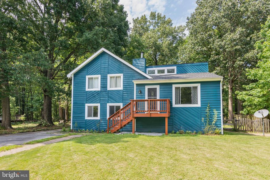 Are you looking for a house to make your home? Well look no further! This home has been completely renovated and is move in ready with so much to offer! Updated hardwood floors, tile floors, updated kitchen installed this year! 2 completely remodeled full baths, screened in porch right off the kitchen and large multi-tiered deck. HUGE fenced in backyard with shed and additional outdoor storage. Home was recently painted, 2 year old hot water heater, 4 year old roof and brand-new mailbox! Upon entering, you are greeted with a light and airy floor plan, lovely wrought iron banister spindles, vaulted ceilings, skylights and exposed accent beams throughout!(trim is to be finished to the buyers liking) This home offers three levels of living space, from the family room to living room, to your kitchen/dining room combo. Bedrooms are large with tons of natural light gleaming through. Your laundry room is combined with a workshop, complete with workbench and inside access to your crawl space. Brick faced fireplace with wood burning insert that pumps out tons of heat! Located in water privileged community, just a block from the Chesapeake Bay. You're going to want to see this one, so call today for your private tour!