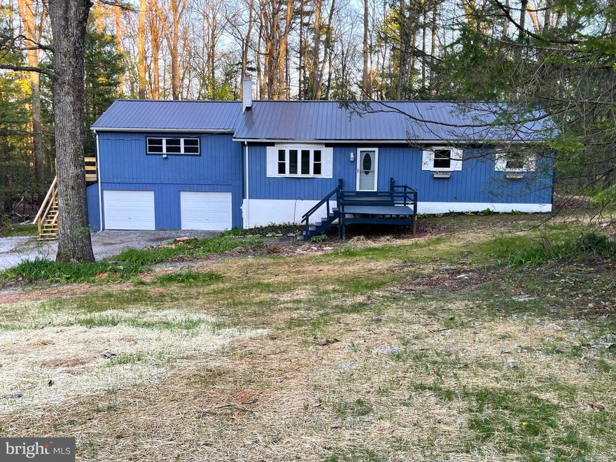 You must see this great 3 bedroom, 2.5 bath home located on a gorgeous 1.35 acre wooded lot in Adams County! This beautiful home boasts recessed lighting, hardwood floors, a wood stove with a stone surround, an updated kitchen with granite countertops and new stainless steel appliances, new carpeting, and remodeled bathrooms. Plus there is an in-law suite, with its own entrance that includes a living/bedroom area, kitchenette, and full bathroom, along with its own heating/central air system. On the lower level you will find a huge space with lots of storage and potential, as well as a very cool coal stove. Outside the wooded backdrop is stunning and the back deck is great for outdoor entertaining. And did I mention the 2-car attached garage? Or the new septic system? Other notable features of this great home include: central air,  a new metal roof, new ceiling fans, and a generator-ready set-up! This house is everything you have been wanting, so set up a showing today!