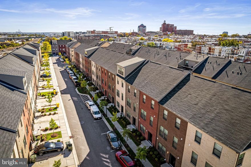 $27,000 IN INCENTIVES — BUY WITH LITTLE TO NO MONEY OUT OF POCKET! Welcome to 614 Mozart Way, a nearly new, beautifully designed 3-level townhome built by Lennar Homes in the highly sought-after Refinery Row community of Brewers Hill, offering 2 bedrooms, 2 full baths, 2 half baths, and a 2-car garage—paired with a compelling $27K incentive package that includes 100% financing with NO mortgage insurance (MIP) and NO HOA dues for the first 12 months when using the preferred lender and title company. Inside, enjoy wide-plank flooring, open-concept living, and designer LED lighting throughout, along with a private rear deck perfect for everyday living and entertaining. The modern chef’s kitchen features shaker cabinetry, granite countertops, stainless steel appliances, and an oversized island that anchors the main living space. Spacious bedrooms include large walk-in closets, while the primary suite offers a double vanity, granite counters, and tile flooring. Ideally located just minutes from I-95 and I-895 with walkable access to Starbucks, Volo Sports courts, shops, restaurants, parks, and Johns Hopkins, this home delivers both convenience and lifestyle. Enjoy added peace of mind with approximately six years remaining on the builder’s structural warranty, plus eligibility for the Johns Hopkins Live Near Your Work $5,000 grant and additional potential incentives. Sample photos and virtual staging shown.