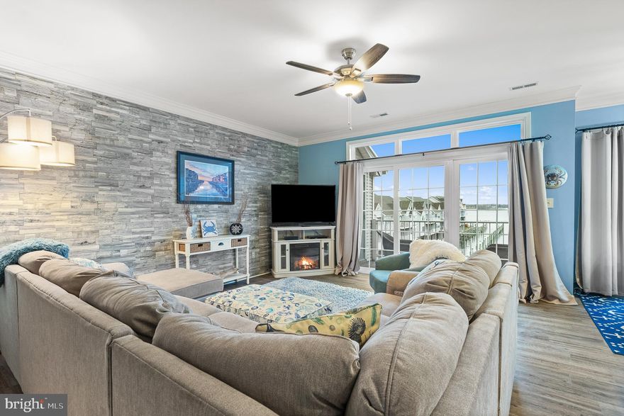 Now you can LIVE YOUR WATERFRONT DREAMS with million-dollar water views in this tastefully decorated AND FULLY FURNISHED rarely available Coastal Decor gem that's turn key ready for you to move right in!  This beautiful 3 Bedroom / 2 Bathroom 1,700 sq ft townhome-style condo Penthouse, with a one car attached garage, is nestled in LIVELY HAVRE DE GRACE, an historic boating town where the Susquehanna River meets the Chesapeake Bay. **********

The main level open concept living room, dining room and kitchen -  ALL WITH DIRECT WATER VIEWS - feature a recently remodeled GOURMET KITCHEN with beautiful granite countertops, stainless steel appliances, 42” soft-close cabinets, decorator hardware and a large center island with eating counter and barstools adjacent to the waterfront dining area. There is woodgrain luxury vinyl plank flooring throughout, and the spacious living room features a faux stone wall, clean electric fireplace, and a wall of view-facing windows  providing cheerful sunlight throughout.  The main level also features 2 charming nice-sized carpeted bedrooms with ceiling fans and a full bathroom. **********

The upper-level Primary Bedroom Suite is spacious and comfortable featuring vaulted ceilings, a sitting nook and balcony with direct water views, a generous walk-in closet, ceiling fan and woodgrain luxury vinyl plank flooring throughout. The Primary Suite Bathroom features a stand-alone soaker tub, a granite double-sink vanity, a large tiled shower with built-in seat, linen closet and a separate large storage room with washer & dryer just outside the Primary Bedroom Suite.**********

Recent updates include new roof (2020), new HVAC (2020), new Pella windows & sliding glass doors (all except in both secondary bedrooms) (2021), new hot water heater (2021), new woodgrain luxury vinyl plank floors throughout (2021), new secondary bedrooms carpet (2021), newly painted throughout (2021), new gourmet kitchen cabinets & appliances (2022) and newly remodeled Primary Suite Bathroom (2022). **********

THE CANVASBACK COVE COMMUNITY FEATURES A BEAUTIFUL COMMUNITY POOL and MARINA for residents. The condo fee includes building insurance, pool maintenance, exterior maintenance of the condominiums & grounds, and trash & recycling pickup. **********

FABULOUS LOCATION! Park your car and leave it! Canvasback Cove is within walking distance of the delightful downtown area with its eclectic shops and myriad restaurants as well as the many museums, parks, war memorials, marinas, churches, and medical offices dispersed around town - plus a $9M library. 
The historic Concord Point Lighthouse in the expanded Concord Point Park are home to Havre de Grace's renowned PROMENADE, a scenic boardwalk which meanders along the Susquehanna River from the Lighthouse to the city Marina and Tydings Park, where many concerts & festivals, family picnics and pickleball games are held. **********

In 2014, Havre de Grace was voted "one of the nation's top 20 (#12) small towns to visit" by Smithsonian Magazine, and it was named one of the 10 Towns in Maryland with The Best, Most Lively Main Streets. There are continuing enhancements being added to the town...some recent ones include several wedding sites, 2 awesome concert/theater venues, shopping district brick streets and streetscape, and THE TIDE - a "park and ride" free seasonal jitney service that takes folks around town to the various places of interest on weekends, so RIDE THE TIDE! **********

FUN ACTIVITIES GALORE! Havre de Grace features First Fridays, a Saturday Morning Farmers Market, Thursday night sailboat racing, a waterfront Promenade, live music, the Arts, parades, festivals, fireworks, restaurants, shops, bars, and marinas all within walking distance of Canvasback Cove.  Live where you love to play in this carefree community!  You'll feel like you are on vacation year-round!  A very special opportunity!**********

Easy access to I-95, APG, Amtrak, BWI, and Philadelphia airports.