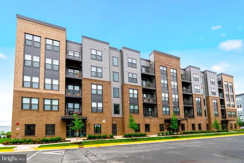 Photo of 21950 Garganey Terrace #407, ASHBURN, VA 20147 (MLS # VALO2120104)