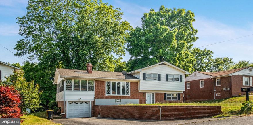 We are Back! Welcome Home to this beautiful  tri-level brick home on a large level lot. Main level includes a living room with a fireplace, a brand new kitchen with high end appliances, a separate dining room, a huge 25x11 Sunroom off the dining room and a nice size deck. The First level has 3 bedrooms and 2 full baths. The Newly remodeled lower level has one bedroom, a flex area with a walkout to the rear patio and grilling area, a full bath and a recreation room ideal for movies or just to hang out! Other updates include, new roof (2021), new exterior steps and asphalt walkway, ext/interior doors, new painting. Close to plenty of shopping and access to Rt 97 & 695 for your commute! All you have to do is move-in and start enjoying! Schedule your showing today! Don't miss out on this Deal! SOLD AS IS!