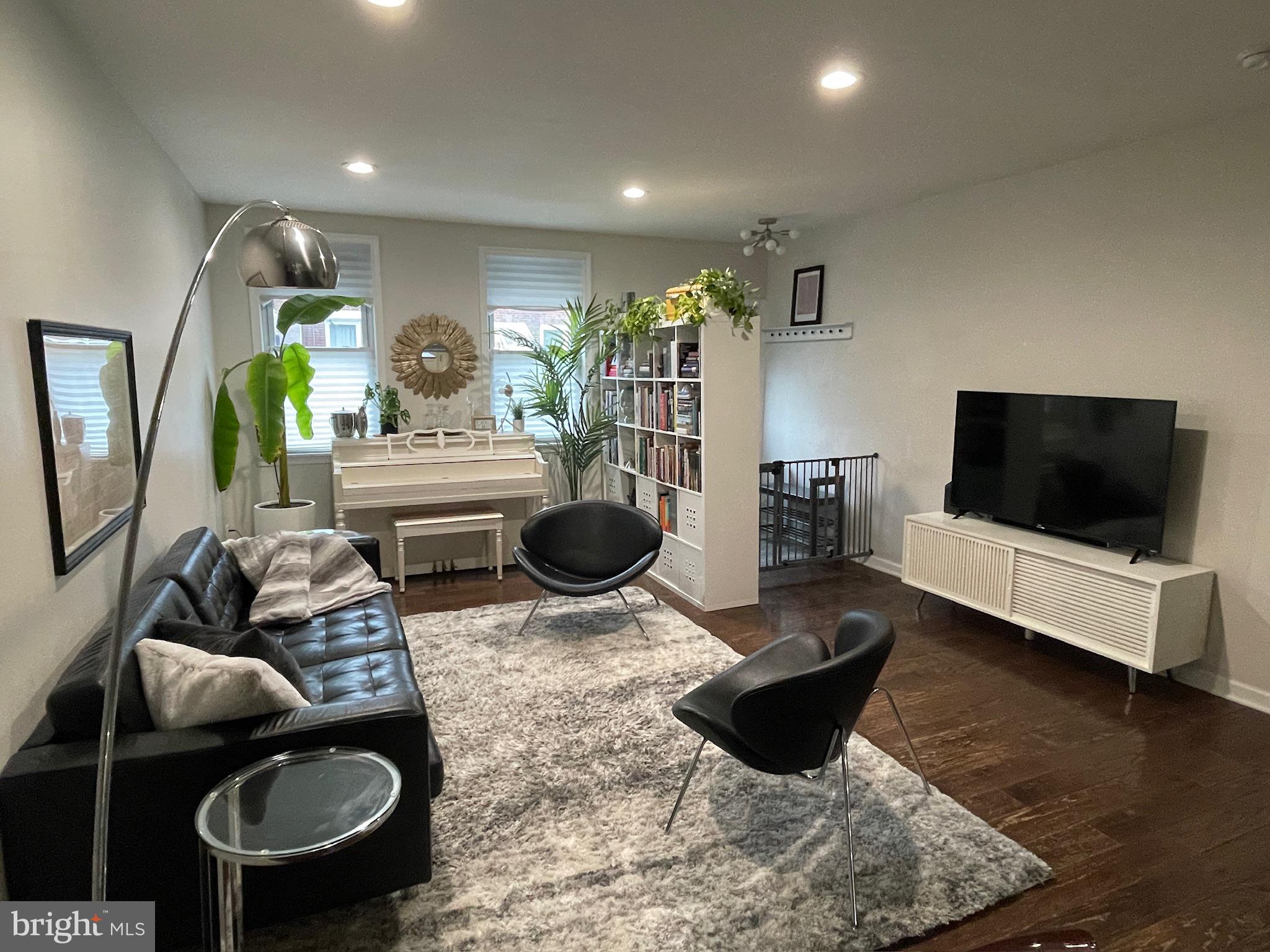 Welcome to this beautifully updated 4-bedroom, 2 full and 2 half-bath home, ideally located in one of Philadelphia’s most vibrant neighborhoods—East Passyunk. Offering the perfect blend of modern comfort and timeless character, this spacious residence delivers exceptional city living just steps from the best dining, shopping, and green spaces South Philly has to offer. Step inside to a bright and open first floor featuring a seamless flow between the living, dining, and kitchen areas, plus a convenient powder room—ideal for entertaining. The newly renovated chef’s kitchen is a standout, equipped with sleek stainless steel appliances, a statement island for casual meals and prep work, and abundant cabinet space. Just beyond, the private rear patio offers the perfect retreat for morning coffee or al fresco dinners. Upstairs, the sun-drenched second level offers three spacious bedrooms and a beautifully appointed full bathroom, complete with a double vanity and sleek glass-enclosed shower—providing comfort and style for family and guests. The third floor boasts a luxurious primary suite with a spa-like bathroom, offering a peaceful retreat at the top of the home. Just beyond, step out onto the stunning rooftop—a true standout feature—offering endless potential for an outdoor oasis, entertaining space, or simply soaking in breathtaking views of the Philadelphia skyline. The finished basement extends your living space with a flexible area perfect for a media room, gym, home office, or guest suite—complete with its own half bath, laundry room, and storage. Enjoy unbeatable walkability with top-rated restaurants like Laurel, River Twice, Mish Mish, and El Chingon just around the corner. Grab coffee from Rival Bros or treat yourself to sweets at Termini Bros Bakery and Nonna & Pop’s. Spend weekends at Dickinson Square or Columbus Square Park both offering family- and pet-friendly amenities. Commuting is a breeze with the Broad Street Line and SEPTA Route 47 bus nearby, offering quick access to Center City. You'll also enjoy close proximity to the iconic Italian Market—one of the nation's oldest and most vibrant open-air markets—as well as the Bok Building, a dynamic community hub featuring creative workspaces, trendy pop-up restaurants, and lively rooftop events. With beloved neighborhood events like Flavors of the Avenue and the Fall Festival, this location truly offers the best of South Philly living. Don’t miss this rare opportunity—schedule your private tour today!