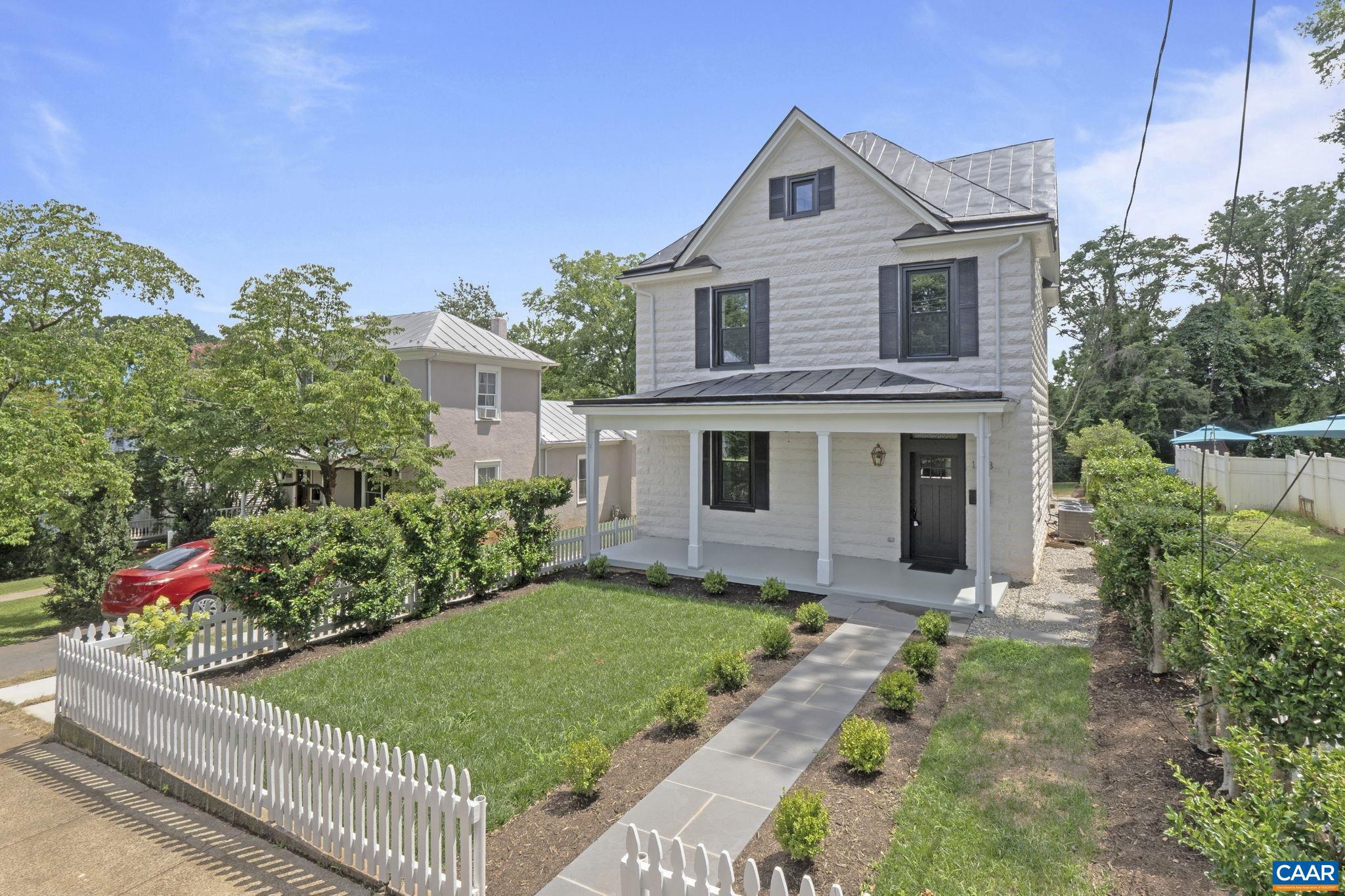 Exceptional renovation of a classic city residence with attention to detail and elegant, timeless finishes. The home was taken down to the studs and rebuilt, tailored to today's lifestyle. Highlights of the home include: 10 ft ceilings on the main level, 9 ft ceilings on the second level, gleaming hardwood floors, upgraded trim and moldings throughout, premium Pella windows, recessed lighting, gas fireplace, and built in speakers accessed through blue tooth technology. The spacious kitchen is the heart of the home with the large center island. Quality finishes are found throughout this special space: abundant Kraftmaid Monclair maple cabinets, Brazilian Carrera Dolomite Natural Stone, Professional Gas Range with pot filler, and beautiful hardware. A walk-in pantry and laundry room are located just off the kitchen and add to the function of the space. All three bedrooms have ensuite baths. The two larger baths have double sinks and Italian Marble finishes. Enjoy city living on the front porch or back deck that overlooks the flat rear yard. 2 story unfinished dependency adds to the appeal of this special property. A short walk to Downtown and surrounding areas!,Maple Cabinets,Marble Counter,White Cabinets,Fireplace in Living Room