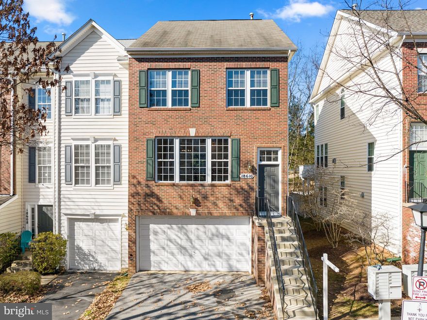 Rarely available gorgeous brick-front end-unit with 2-car attached garage and updated throughout! Spacious 9 ft. ceilings on all 3 levels! All 3.5 bathrooms have been nicely updated. Hardwood floors on the main AND upper levels, LVP flooring on the lower level (no carpet in this home!). 
The main level open floorplan is so bright and light with oversized windows, high ceilings, and a large eat-in gourmet kitchen. Stainless steel updated appliances, with a brand new refrigerator and granite countertops. The power room completes the main level. 
Upstairs is the primary suite with large windows and a walk-in closet. Completely updated owner's spa bath with walk-in tiled shower, 2 sinks, and a soaking tub.  Two additional bedrooms, a hall bath and laundry complete the upper level. The bright lower level has a spacious open room with so many uses; rec room/ gym/ office/ guest room and full bathroom. LVP flooring and a cozy gas fireplace flanked with glass doors to the private backyard. Convenient access to the attached 2-car garage (with a storage room) and 2-car driveway. The HVAC was replaced 5.5 years ago, hot water heater is 2 years old. This home is truly move-in ready! The clubhouse and pool are an easy walk around the corner. Fountain Hills Park has a fun playground, ballfields, tennis and basketball courts. Starbucks and grocery are across the street. Quick access to I-270 and a 5-minute drive to MARC train station.