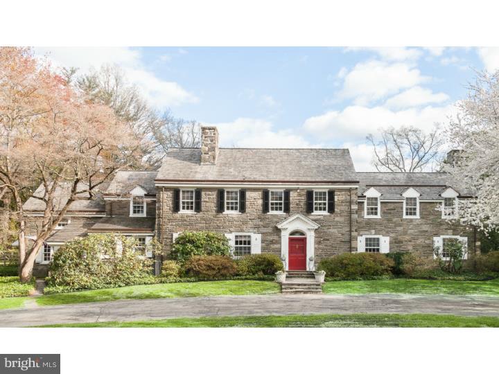 This classic Main Line field stone Colonial Revival is located on one of the most sought-after and picturesque streets in desirable North side Bryn Mawr. The house is set well off the road and fronted and backed by exhilarating lawns and expansive landscaping. Stone pillars and a graceful curved drive lead to this magnificent home, which is sited on 1.73 acres of perfectly maintained grounds at what is said to be one of the highest elevations in the Lower Merion Township. The rear of the property is almost a park-like setting with gardens and an expansive lawn ending in a wooded stand of trees which act as a privacy screen. It features elegant flagstone terraces with awnings and built cover, a secluded swimming pool, and a charming two room cottage. Built as a pool house, the cottage has strong guest house potential. The well-proportioned stone house with cedar roof is finely crafted with elegant mill work and plaster walls. There are hardwood floors throughout the entire house and are particularly outstandingly on display on the first floor. The kitchen cabinetry has been custom-built and designed of bird's eye maple with raised paneled doors. The exquisite floor is made of pegged, wide-plank, curly cherry wood. The elegant and spacious entry hall boasts rounded arched openings leading to contiguous spaces and French doors opening to the completely private rear of the property. The house is generously proportioned with elegant windows, light filled rooms, and exudes the quality of construction and design which is its heritage. With its Old World charm, it is ideal for wonderful family (comprised of any and all ages) living and its outdoor amenities invite recreation and extravagant entertaining in a completely private setting.