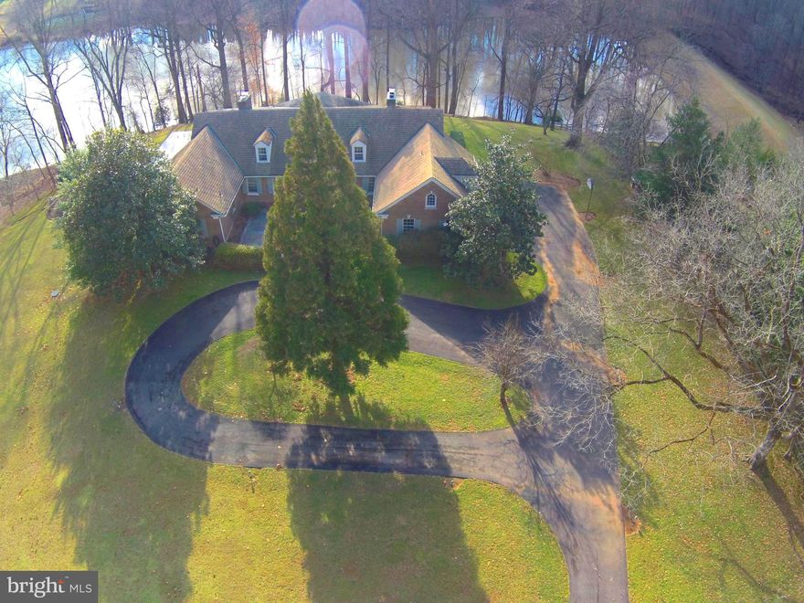 YOU DESERVE TO LIVE IN THIS BEAUTIFULLY SITED ESTATE HOME, PRIVATELY SITUATED AT THE BACK OF A CUL-DE-SAC AMID TOWERING TREES. THIS GRACIOUS MANOR HOME IS CONVENIENTLY LOCATED IN COVETED POTOMAC FALLS ESTATES. IT'S LOVELY 2AC LOT ABUTS 9.5 ACRE LAKE - PICTURE YOURSELF FISHING FROM YOUR BACKYARD. ALL ROOMS ARE SPACIOUS WITH HIGH CEILINGS. THERE IS A MAIN LEVEL MASTER SUITE WITH ADJOINING LIBRARY & SUNROOM. THE FAMILY BEDROOMS ON THE UPPER LEVEL ARE ENORMOUS & THERE IS TONS OF STORAGE. THE LOWER LEVEL INCLUDES CHANGING ROOMS FOR POOL - NANNY/AU PAIR SUITE ABOVE GARAGE. THERE IS LOADS OF ROOM FOR EXPANSION & RENOVATION TO MAKE THIS HOME YOUR NEXT HOME SWEET HOME. HOA & DUES ARE NOT MANDATORY!!