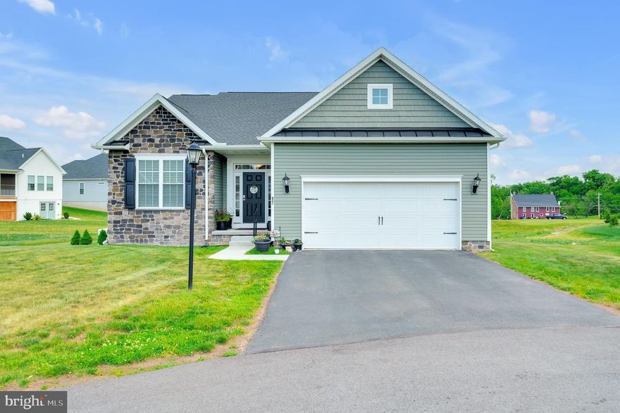 Welcome to Cumberland Village at Marsh Creek, ideally located just minutes from the charm and history of downtown Gettysburg, Pennsylvania. Built in 2022, this beautifully designed ranch-style home offers modern living, thoughtful design, and low maintenance,  HOA mows your lawn!
Step inside to an inviting open-concept floor plan featuring durable and stylish vinyl plank flooring throughout. The heart of the home is the stunning kitchen, complete with granite countertops, ample cabinetry, pantry and seamless access to a lovely rear deck—perfect for entertaining or enjoying peaceful evenings outdoors.
The main level offers three spacious bedrooms, while the fully finished lower level expands the home’s possibilities with a complete in-law suite. Downstairs, you’ll find three additional bedrooms, a full bathroom, a kitchenette, and a walkout basement with its own private entrance—ideal for multi-generational living, guests, or potential rental income. Giving this home over 3000 sq ft of living space.
Enjoy scenic mountain views from the front of the home, adding a tranquil backdrop to your everyday life. With six total bedrooms and flexible living space, this home is a rare opportunity to own a nearly new property that truly can  adapt to your needs.