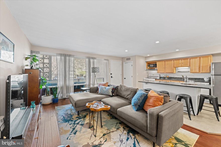 Discover this hidden gem! A well-appointed condo featuring both a welcoming front porch and a serene, quiet back balcony overlooking lush green space. The perfect spots for relaxing or entertaining. Step inside to appreciate the floor-to-ceiling windows, creating a home filled with natural light. The open kitchen with an oversized island flows seamlessly into a spacious living area —ideal for hosting or unwinding after a long day.

The generously sized primary suite is your private retreat, complete with an ensuite bath and access to the rear balcony. The second bedroom is perfect for family, guests, or as a home office. The convenience of two full bathrooms makes hosting guests or family living effortless and comfortable. Enjoy abundant storage options throughout the condo, including multiple closets and additional dedicated storage space.

Don't miss the opportunity to make this unique condo your home!