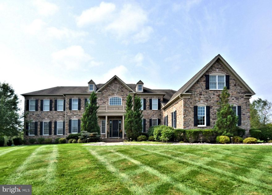 Situated perfectly on an immaculately maintained 1.19 acre parcel sits this spectacular expanded all Stone Front / Hardie Plank Henley model with 6/7 bedrooms, Toll Brothers most popular floor plan. Located in one of Upper Makefield's most sought after and prestigious communities, Dutchess Farm Estates, this home offers the discriminating buyer a wide array of luxury, comfort and construction features and is in mint, turnkey, move-in condition. Enter the soaring two story marble floored foyer, featuring dual curved staircases with wrought iron balusters, and gleaming hardwoods throughout the entire first floor. Impressive 10' first floor ceilings, 9' upper level ceilings, detailed crown, trim, and box moldings are featured throughout this beautiful home. The elegant formal dining room, with tray ceiling is to the right, formal living room to the left. Double doors will lead you from the LR to the giant conservatory, with 11'ceilings, walls of windows on three sides, multiple entertainment/seating areas and gorgeous full-service bar. Bar features include wine cooler, sink, gorgeous cabinetry, and double tiered granite bar top with seating for 6. The gourmet kitchen is a chef's delight, featuring a large triple tiered center island with second sink and seating for 6, upgraded stainless-steel appliances including Wolf 6 burner stove / gridle with full oven and bread oven, stainless range hood, Wolf wall oven and convection/ microwave, Sub Zero 48" side by side refrigerator / freezer, and two Asko dishwashers. Granite counters, 42" cabinets, under cabinet lighting, tumbled stone backsplash, walk in pantry, vegetable sink, tons of cabinet space, desk area, expanded breakfast room with skylights, triple French Doors leading to the rear paver patio, and rear staircase access make this the most spectacular kitchen on the market today. The two-story family room features impressive floor to ceiling stone fireplace (gas) with spectacular box trim millwork ceiling. Perfect for these times are TWO well appointed large private home offices, ideal for all of your Zoom calls and conferences or virtual schooling, laundry/mud room entry w/ built-ins, and powder room complete the first floor. This popular floor plan was designed for maximum entertaining, large holiday and family gatherings, and work/school from home space and privacy. The upper level, with 9' ceilings, features a total of 5 spacious, bright and airy bedrooms, including the Master Suite. The fabulous Master Suite consists of a large sitting room, main bedroom with coffered ceiling, luxurious Master Bath with oversized shower, jetted tub, his and hers large walk in closets ( 3 total ), exercise area, his and her toilettes, his and hers granite counter vanities, and radiant heated ceramic tile flooring. Bedrooms 2 thru 5 are all generously sized and are equipped with private baths, large closets, and ceiling fans. The giant finished lower level features a walk out staircase, Bedroom 6 with attached full bath perfect for guest, in-law or Au Pair, elevated dance floor with mirrored wall, plenty of entertainment and recreation space, additional finished room ideal for gym, music, craft, or 7th bedroom, and ample storage areas. This beautiful Cul-de-Sac lot backs to woods and over 37 acres of preserved space, where you will enjoy incredible Bucks County views and sunsets from your paver patio. The grounds, lawn and plantings are absolutely impeccable.  A 4-car garage with painted floor, back-up whole house generator, 6 zone Heat/AC for maximum energy efficiency, security system & much more await you. Located just minutes from Newtown Boro, New Hope Boro and New Jersey Bridges in the heart of Upper Makefield and the Council Rock School District. The home and property, with over 9,500 sq. ft. of finished space, have been lovingly maintained and are offered for the first time by its original owners.