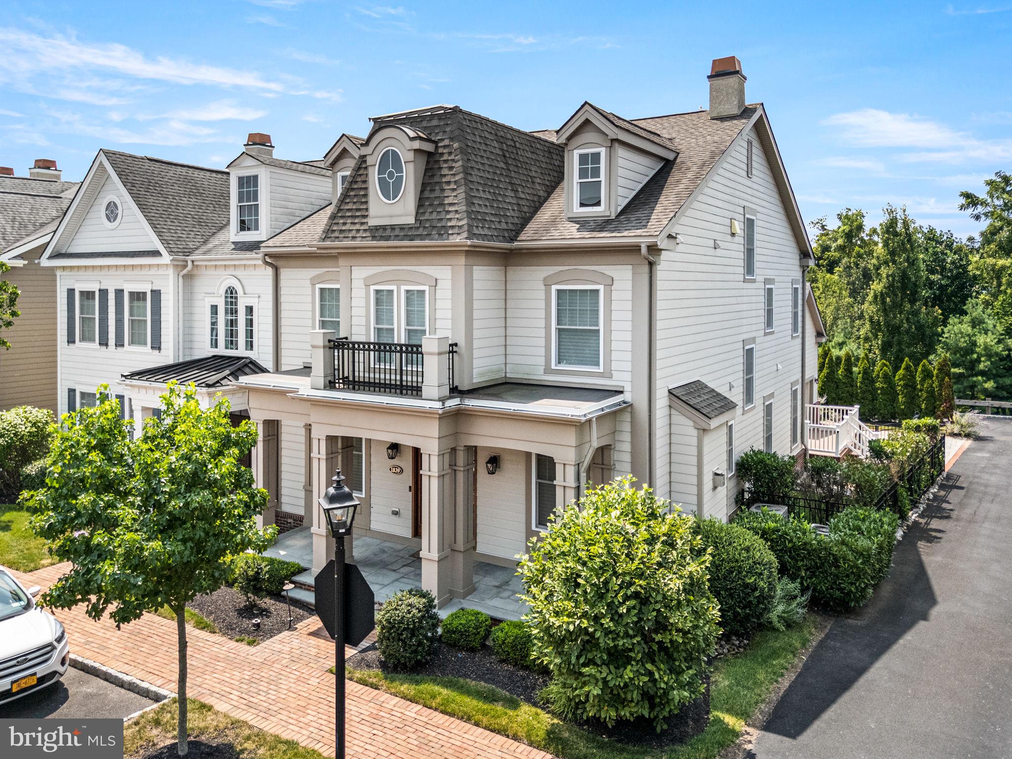 Welcome to 1839 Windflower Lane- An Exceptional Luxury Retreat in Yardley’s Most Sought-After Enclave. Nestled in the heart of prestigious Yardley, this exquisite home at 1839 Windflower Lane blends timeless sophistication with refined modern living. Set on a beautifully manicured lot in a quiet, tree-lined neighborhood, this residence offers unmatched elegance and attention to detail. From the moment you arrive, you are greeted by impeccable curb appeal—lush landscaping, a stately HardiPlank façade, and an inviting covered entryway that sets the tone for what lies within. Inside, soaring ceilings, rich hardwood floors, custom millwork, and designer lighting create a striking first impression. The heart of the home is a gourmet chef’s kitchen, appointed with top-of-the-line Sub Zero, Viking & Wolf appliances, quartz countertops, custom cabinetry, and two oversized islands perfect for entertaining. Just off the kitchen is the butler’s pantry, with tons of cabinet space for more storage and a sink. Seamlessly connected to the dining area and expansive family room with a coffered, this open-concept space is ideal for everyday luxury living and elegant hosting alike. Down the hall are two more generously sized coat closets, access to the oversized two car garage, and sliding glass doors leading out to your Trex Deck. Retreat to the lavish primary suite on the second floor, a serene sanctuary featuring tray ceilings, a spacious sitting area, walk-in closet with custom organization, and a spa-inspired en suite bath with a soaking tub, oversized glass shower, and dual vanities. Two additional bedrooms on this level are equally well-appointed, offering ample space and comfort for family or guests. One of the additional bedrooms has an en suite full bathroom, and a nicely sized walk in closet with custom organization. The main laundry room is on this floor for optimum convenience, featuring top of the line GE front loader washer and dryer. On the third floor, you will find the 4th bedroom with a huge walk in closet with custom organization, along with a full bathroom. This bedroom could be used as a loft space, gym, playroom, mancave- the possibilities are endless. The finished lower level provides even more living space, equipped with a kitchenette and huge walk-in closet, which would be ideal for an in-law suite, home theater, fitness center, or game room. There are 2 additional closets, an unfinished area, and a second set of washer & dryer that makes up the rest of the lower level. Additional highlights include smart home upgrades, and access to top-rated Pennsbury School District. Ideally located just minutes from historic Yardley Borough, fine dining, shopping, and major commuter routes, this home offers the perfect blend of luxury and convenience. 1839 Windflower Lane is not just a home — it's a lifestyle. Schedule your private showing today and experience the unparalleled quality and elegance this remarkable property has to offer.