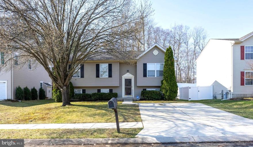 Welcome to this beautifully maintained split foyer home in the desirable Harford Town community of Abingdon! Offering over 1,800 square feet of finished living space, this spacious 4-bedroom, 2.5-bath home combines comfort, functionality, and classic charm. 

Step inside to a traditional floor plan featuring a bright living room, formal dining area, and a kitchen with convenient combination dining space—perfect for everyday living and entertaining. Thoughtful details such as crown moldings, chair railings, and wainscoting add character throughout.

Upstairs, the primary suite includes its own private bath, while two additional bedrooms and a full hall bath complete the main level.

The fully finished lower level provides additional living space with a cozy family room featuring a fireplace, a fourth bedroom, and a half bath—ideal for guests, a home office, or flexible living needs.

Enjoy outdoor living on the rear deck overlooking a fenced backyard—perfect for relaxing, entertaining, or pets. Additional highlights include public water and sewer, natural gas heating, central A/C, and off-street parking.

Conveniently located near major commuter routes, shopping, and dining, this home offers both comfort and accessibility.

Don’t miss your opportunity to make this well-appointed home your own!