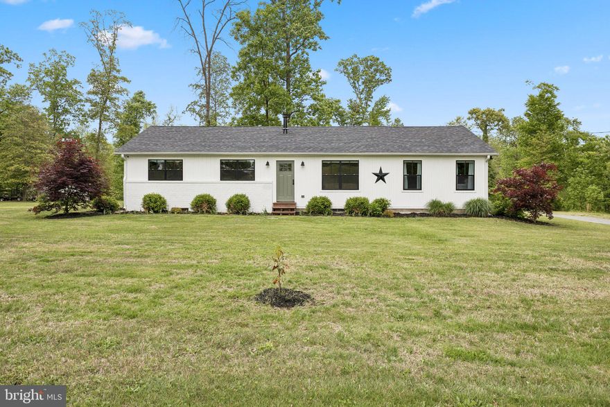 Welcome to 9816 Fairlee Road. Be Sure to Click the Virtual Tour!! This property has been meticulously cared for by the current owners and it shows. The property sits on 6.29 acres! If you want plenty of land without giving up on high end fixtures, this is the home for you. Pride of ownership shines through in this gem of a home. The paved driveway leads to a parking pad and a beautiful piece of property. This rancher gives you plenty of space both inside and out. Recently, there was an addition of a mudroom and a second owners suite. Both owners suites have their own bathroom and walk-in shower and one even has a jetted Jacuzzi tub to help you unwind after a long day. There is upgraded flooring through-out, whether it be hardwood or tile, every room feels polished and upscale. The living room includes a woodstove that was installed in 2025 along with a new chimney pipe.  There is a creek directly behind your property, which means, water is just a short stroll away. Enjoy tons of natural light in the spacious kitchen where quartz countertops are partnered with a Stainless Steel Refrigerator, built-in microwave and stove.  Soft-close cabinets and drawers add to the upscale feel. This home has three spacious bedrooms and three full baths.  The un-finished lower level provides you with even more space for storage or it can be your very own blank canvas to finish and increase your living space. The laundry area is in the basement and the washer and dryer will stay with the home. The sliding glass door in the kitchen allows access to your deck and backyard. Enjoy the peace and quiet. Don't be surprised if you see ducks, turkey or deer, they have been known to enjoy the 6+ acres too! The water treatment system has been thoroughly maintained and will convey with the home. High Speed Talkie internet is available. New windows installed throughout most of the home in 2020. This is an Amazing Home! It is turn-key and ready to Welcome its New Owners.