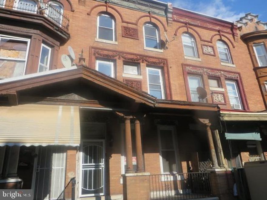 Three story, porch front Triplex located just off of Broad St and close to Temple University Hospital. Two bedroom apartment on the 1st floor, two bedroom apartment on the 2nd floor, plus one bedroom apartment on the 3rd floor. Central Air and all separate utilities. Tremendous rental potential. Property being sold strictly As Is.