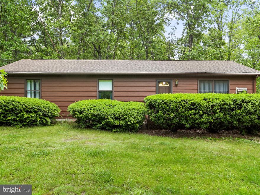 Discover this unique opportunity offering two separately deeded lots totaling over 12 acres of peaceful countryside. Lot 35 features a spacious 4-bedroom, 2-bath raised rancher on 6.32 acres, while Lot 36 is a 6.5-acre vacant lot—ideal for future expansion, recreation, or investment potential. The home features a recently replaced roof and brand-new steel siding. Inside, you'll find a bright living room with LVP flooring and a large bay window, a tiled kitchen with two oversized pantries, and a wrap-around deck just off the kitchen—perfect for entertaining or enjoying scenic views. The main level offers three bedrooms, including a primary suite with an updated bathroom featuring a stand-up shower and LVP flooring. The walkout basement adds additional living space with a large family room, fourth bedroom, and ample storage. A water treatment system is already in place for added convenience. Outside, a detached 2-car garage with a pellet stove provides year-round functionality, and two run-in sheds are located just off the garage—great for animals or equipment storage. Whether you're looking for a peaceful homestead or a property with room to grow, this one checks all the boxes!