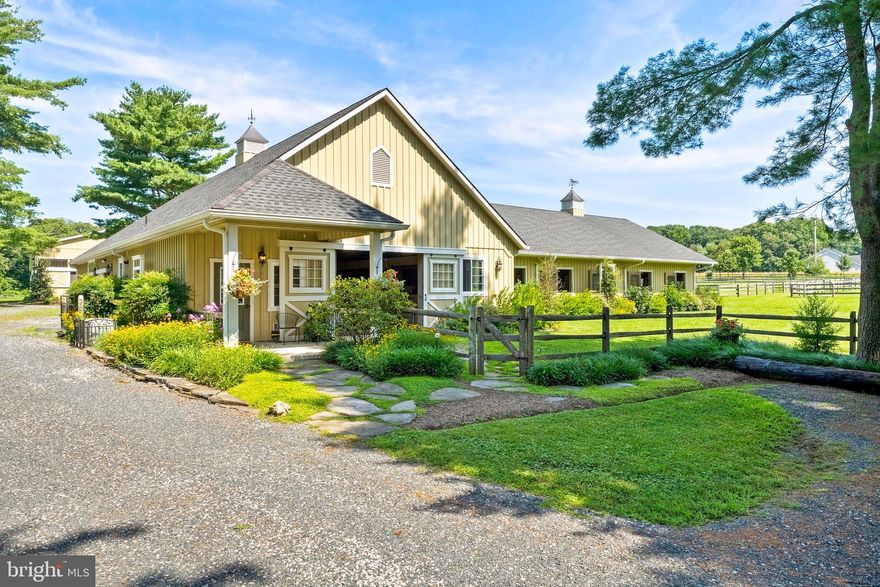 Welcome to Adelheid Manor! A picturesque setting from the moment you turn onto the tree-lined gated entry and take in the smell of pine that leads you into 13.69 acres surrounded by mature trees and professional landscaping. Originally built in 2012, no expense was spared. There is a main barn with a 14 stall custom quality Amish-built barn; plus a newer second 4 stall Amish-built shed row barn for additional full/part-time boarding, temporary boarding, or great quarantine space for new horses.   The main barn features full-screen swing doors and yolked windows to the exterior. A spacious tack room, feed room, wash stall with hot & cold water, and two grooming stalls; all with insulated ceilings above every stall. There is a large attic for storage and easy access to the fly mitigation system. Take a look inside the impressive indoor lighted arena and you'll see this is exactly what you need for your Dressage, Hunter/Jumper, or Eventers!  Amish built – wood (not metal) tongue and groove, hand stained and glazed. The entire building measures  a total of 228’ x 80’.   The grand arena entry measures  48’ x 80’ with equine treadmill area and ramp to raised viewing area.   The large sliding barn doors allow easy entry for horses into the lighted riding arena, measuring 180’ x 80’.  There is a raised observation area, solar screened windows with sliding doors and Eurofelt footing with polymer coating allows for dustless riding. Notice the tongue and groove craftsmanship includes the wood ceilings with no exposed beams or trusses to prevent any birds from nesting above your riding space.  The shingled roof makes for quiet riding sessions in any weather. This impressive property maintains a focus on horse safety and function while incorporating unique design features. There are eight paddocks; each with watering systems. Take comfort while observing the training efforts of the outdoor riding ring from the screened gazebo with an overhead fan...or spend some time working with the horses in the newer round pen. The main home exudes farmhouse charm and character boasting recent upgrades throughout making this 3-4 Bedroom, 2 Bath w/ updated kitchen and JennAir appliances a lovely place to call home. 1933 SF above grade (tax records are incorrect) plus a partially finished basement.  The home has a separate driveway if you wish to have additional private parking.  There is an additional  two-bedroom caretaker/guest cottage that was also recently renovated to perfection with white cabinets, quartz countertops, porcelain tile, and marble. The main house and the barn each have propane powered generators. Choose one of the three options for your farm office(s) - main house, barn, and cottage auxiliary room with a separate entrance. Take advantage of the detached two-car garage as a workshop area, for extra equipment storage, or use it simply for parking your cars. The property perimeter fencing has electric lines at the base to deter wildlife.  There are electric lines along the paddock fencing to preserve/protect the boards. Drainage and soil management upgrades have all been handled for you. Optional rear gated entrance to the farm, if needed. Conveniently located off of Rt 50, it is 15 minutes to Annapolis, 15 minutes to Prince George's Equestrian Center and 30 minutes to Washington DC and Baltimore.  As you browse through the photos please note that they were taken throughout different seasons and some are older than others.   24 hour showing notice preferred.  You will truly enjoy this unique equestrian property with top-of-the-line amenities in beautiful Davidsonville!