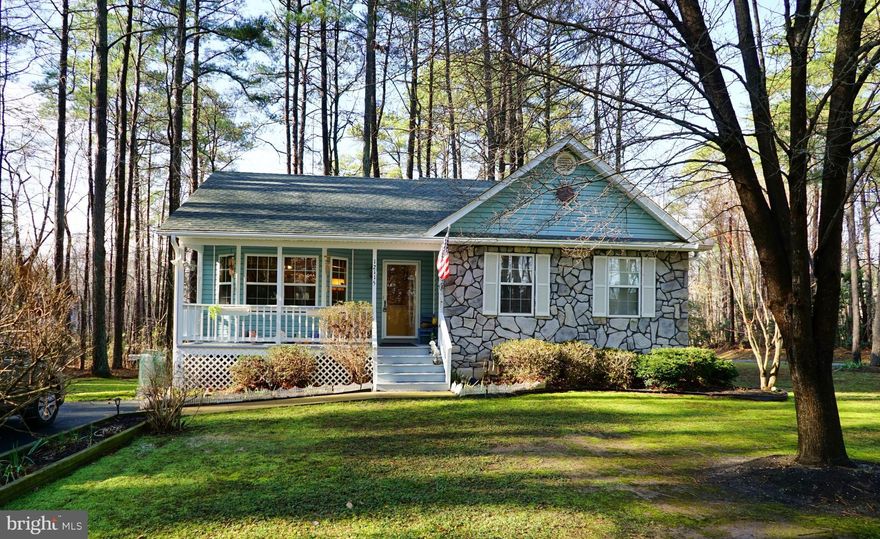 Charming cottage nestled on a peaceful corner lot with front porch, rear deck, and paved driveway.  Master bedroom has full bath and walk in closet. Two additional bedrooms on main level with a full bath.  The complete walk out basement is ready for your finishing touches and has space for rooms and a rough in for future bath. Kitchen is complete with granite counter tops, walk in pantry and table space. No disappointments here! The community offers lakes, playgrounds, and beaches.