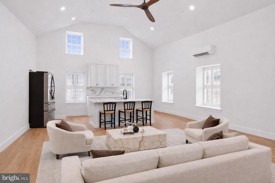 Welcome to The Falls at New Hope, an exclusive luxury townhome community designed by award-winning architect Ralph C. Fey, where refined design, natural beauty, and effortless living come together in one of Bucks County’s most sought-after locations. Perfectly positioned between Aquetong Creek and the historic Delaware Canal Path, this residence offers a rare opportunity to experience sophisticated living just moments from the heart of downtown New Hope.

This beautifully designed one-bedroom, one-bath residence showcases an open-concept layout highlighted by soaring ceilings, expansive windows, and an abundance of natural light that enhances the home’s airy and inviting feel. The gourmet kitchen is both striking and functional, featuring crisp white custom cabinetry, dramatic veined stone countertops and backsplash, high-end stainless steel appliances, and a spacious island ideal for everyday living and entertaining. The seamless flow between the kitchen and living space creates a modern yet comfortable environment, perfectly suited for both quiet evenings and hosting guests.

The bedroom offers a peaceful retreat with generous proportions and thoughtful design, while the spa-inspired bath features clean lines, elevated finishes, and timeless appeal. Throughout the home, meticulous craftsmanship and contemporary details reflect the quality and vision behind this architecturally significant community.

Residents of The Falls at New Hope enjoy a low-maintenance lifestyle with association-covered common area maintenance, allowing for true ease of living. Just moments away, New Hope’s vibrant downtown offers renowned restaurants, boutique shopping, art galleries, and cultural attractions, including the historic Bucks County Playhouse, while neighboring Lambertville adds even more charm just across the river.

Life at The Falls at New Hope offers a unique balance of tranquility and energy, where scenic mornings along the canal and lively evenings in town become part of your everyday experience. With its exceptional design, premier location, and luxurious finishes, this residence presents a truly special opportunity to own in one of New Hope’s most distinctive communities.