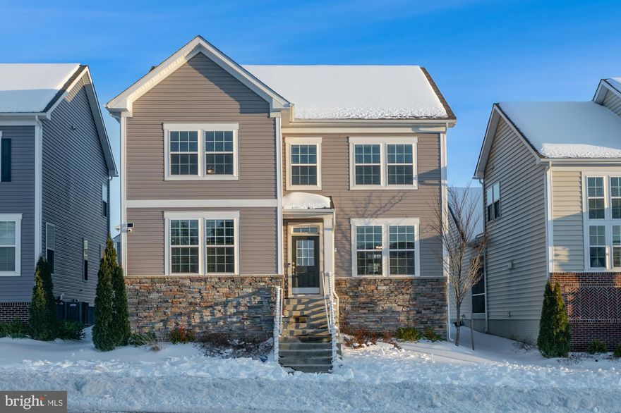 Charming neo-traditional home with 2-story family room windows that let in great light and fantastic mountain sunset views! This Dan Ryan Jefferson II model is only a few years old, but feels brand new, very clean and lightly lived in. Enter from the covered portico and beautiful foyer in the front of the home and formal dining room. OR, enter from the back entrance with  attached two-car garage and deep driveway enough to park additional vehicles. It's a very practical set up from the back, with powder room, closets, cubby and pantry. Easy access to the bright kitchen with separate morning room with morning light, quartz countertops and stainless steel appliances including gas range. Upstairs, the primary bedroom is spacious and serene with a tray ceiling, several windows, large walk-in closet, and en-suite bath with both soaking tub and walk-in shower. Two additional bedrooms and laundry can be found on this level AND a great look out down to the family room. The large basement is unfinished with a bath rough in and full size window, so this house can easily be made into a 4 bedroom 3.5 bath home. The yard is level and mowing is included as part of the HOA fee. Come and see what Brunswick Crossing is all about! Swimming pool, tennis, community center, fitness center, basket ball courts, beach volley, soccer field, dog parks, community garden and walking trails for miles nestled through the community. You will love living here! Schedule your showing today!