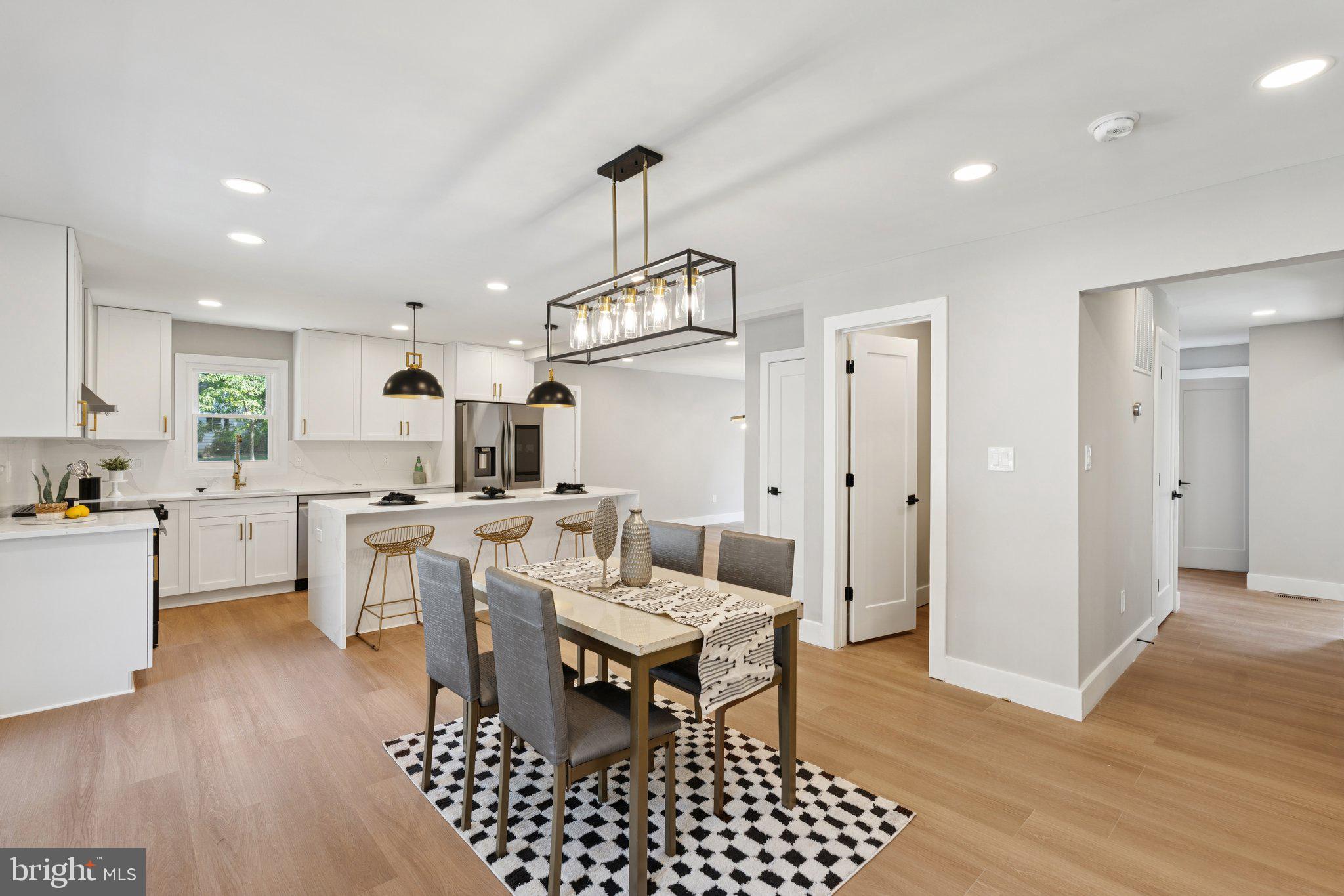 Welcome home to this stately brick front home on a quiet street in the sought after Miller Heights Community! This recently renovated home features five generously sized bedrooms, four full bathrooms, one half bathroom, and new everything! As you enter the home you are greeted with the gorgeous curved staircase and the beautiful natural colored LVP flooring that flows throughout the entire home, a formal living room and dining room, as well as an open concept kitchen into family room with a cozy built in fireplace, and kitchen that is a true chef's dream with brand new stainless steel appliances, smart fridge, clean marble countertops with white cabinets, gold pulls, and a waterfall marble kitchen island. With tons of light, a primary suite with en suite bathroom including a modern soaking tub and waterfall shower, it's what dreams are made of, a fully finished basement, deck, and fenced in back yard, and no HOA, this home truly has is it all! It doesn't stop there just minutes from the Oakton Golf and Rec Center, major commuter routes, and close to shopping and restaurants this home truly has it all! In a quiet serene wooded area but conveniently close to everything! Schedule your private tour today before it's too late!