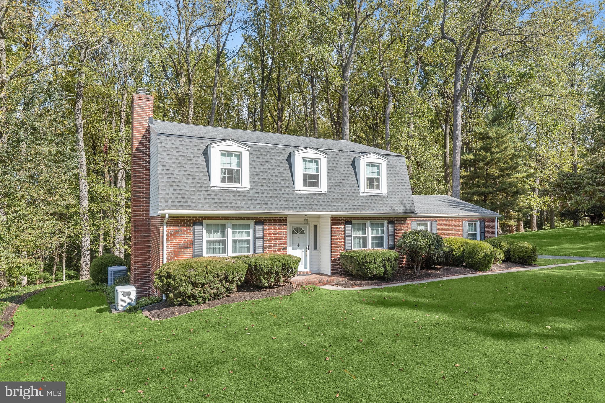 Welcome to this charming four bedroom home in the sought-after Windemere neighborhood, set on an acre lot backing mature woods. Enter into the foyer with hardwood floors, and the living room features crown molding and a wood-burning fireplace. Formal dining room with elegant chair railing and spacious enough for hosting large gatherings. The eat-in kitchen includes gas cooking and space for a breakfast table for casual meals. Relax in the cozy den, which is a perfect spot for kicking up your feet and watching tv. A half bathroom and access to the two car garage finish the main level. Upstairs, the primary bedroom suite offers a walk-in closet, a second smaller closet, and a private bathroom with a walk-in shower. Another three bedrooms and a spacious second full bathroom with a tub-shower complete the upper level. Downstairs, the lower level recreation room is a versatile space for all your needs with a dry bar, and the utility room has laundry and tons of storage. Unwind outside under the covered patio that overlooks the rear yard and trees. Located near a variety of excellent shopping, dining, and entertainment options, with Peerce’s restaurant just down the street, a local creamery nearby and only ten minutes to get to central Towson. For outdoor enthusiasts, the home is around the corner and just a bike ride away from Loch Raven Reservoir, offering hiking and biking trails, rowing, paddleboarding, bird watching, horseback riding, fishing, and more. You will love living in northern Baltimore County, with the peaceful suburban countryside, rolling hills, horse farms and charm. Located in the coveted area of Carroll Manor school district. Recent updates include well pump, water filter system, and a brand new roof (2023). Hardwood floors under the carpet throughout, and ceramic tile under the carpet in the primary bathroom. Home is equipped with a Generac generator.