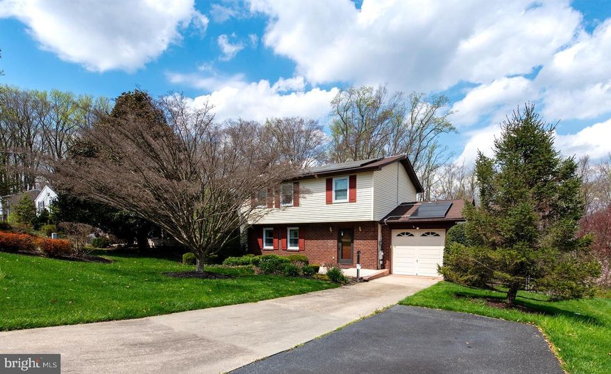 Spacious colonial in the heart of Bel Air backs to stream, open space and wooded retreat. Home had huge addition added in 1996 including 22' x 14' main level, primary bedroom with paneled walls, cathedral ceiling, bay window, walk in closet, primary bath with large shower & seat along with 2nd laundry. This addition also has it's own dedicated heat pump. Country kitchen with table space and ample amount of cabinets. 2nd level has 3 bedrooms including one measuring 17' x 16' with walk in closet. Two full baths on 2nd level too.  Walkout, lower level has 22' x 15' family room with gas fireplace and mantle along with wet bar. Home also has  15' x 14' secure storage room built under addition with mini split system and built ins. Other great features include home generator, central vacuum, and leased solar panels by Sun Run. Tiered backyard with split rail fence. 2 additional sheds. One car garage with opener.  Front yard beautifully landscaped. Rare find with so much too offer!!!