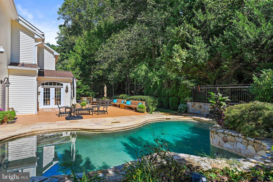 Open Saturday AND Sunday!!! Welcome to a true haven of luxury living! This exquisite property offers an abundance of features that cater to both comfort and convenience. The private rear yard features an expansive deck equipped with a premium speaker system and elegant lighting, all overlooking the captivating Salt Water Pool - an oasis of relaxation and entertainment. This home boasts abundant natural light throughout, with hardwoods on most of the main floor, a wall of windows in the rear of the home, and two dedicated home office spaces to cater to your professional needs. A full bath on the main level provides easy access to the pool area. Fresh paint on many areas of the home. New chandeliers in the kitchen, dining room, and foyer. The sunny breakfast room, has glass doors leading to the deck. Yes, there is a perfectly sized formal dining room. The 2016 renovated kitchen is a culinary dream come true,  with a center island, double ovens, gas cooking, and a generously sized pantry all connected to an oversized laundry room.   Enjoy the cozy fireplace and surround sound sun-filled family room.  Upstairs you are five bedrooms in total, four of which have ensuite baths all with  new faucets.  You will LOVE the whole house fan! Enjoy the primary suite featuring an extensive closet with a window, brand-new glass shower enclosure, large separate soaking tub, two vanities, private water closet, large linen closet, and a sitting room with skylights. A new roof (2021), a custom brick walkway, and extensive landscaping enhance the curb appeal. There is even a house generator plumbed to the gas line, ensuring continuous power supply to most of the home. The partially finished walk-up lower level offers a full bath, one almost finished room, ductwork, and some framing, along with an audio/visual closet and tankless hot water ready for the final touches of installation. HVAC was updated in 2016. Additional amenities include dramatic landscape lighting,  an in-ground sprinkler system, a serene cul-de-sac location within walking distance to the charming Town of Vienna and Madison High School, and the W&OD Trail. A spacious three-car garage with a boat lift, and a fabulous shed that provides abundant storage.  Louise Archer/Thoreau/Madison schools, St. Marks, OLGC, and Flint Hill Private are nearby.  All these minutes to Metro, Reston, Fairfax, Vienna, Tysons, Dulles, and DC.   Photos and floor plans to come!