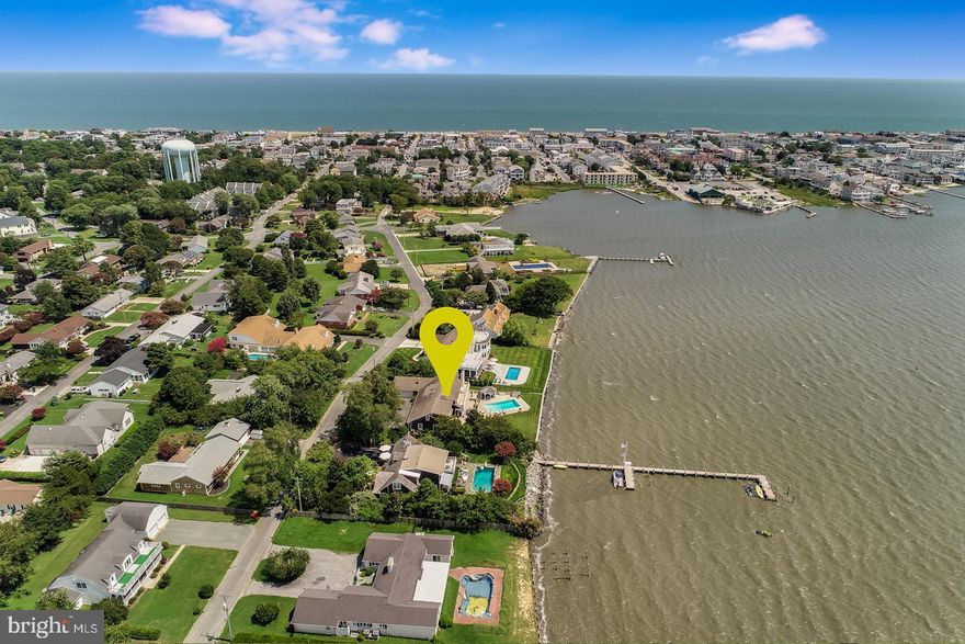 Spectacular Rehoboth Bay front opportunity! Introducing 316 Salisbury Street located in the sought-after bayfront community of Seabreeze and one of the area's best kept secrets. Seabreeze is tucked away from everything, although situated just a few blocks from the ocean beaches, local marinas, restaurants and amazing entertainment options. This home is a charming cedar shake Cape Cod situated on a spacious .39-acre lot with 100 feet of newly bulk-headed direct bay frontage. The welcoming front porch is surrounded by beautiful hydrangeas, knock out roses and mature magnolias that offer the utmost privacy. Upon entry, prepare to be wowed by the striking panoramic views of the Rehoboth Bay through the wall of windows and doors at the rear of the home. The open and airy floorplan is very unassuming offering an abundance of space for entertaining or just simply relaxing. The spacious great room with a wood burning fireplace creates the most intimate of settings. Adjacent to the great room is an elegant dining area that is perfect for more formal occasions and central to everything the home has to offer. In addition, the first floor features a cozy family room complete with another wood burning fireplace that opens to the kitchen. In total, 316 Salisbury boasts 6 sun drenched bedrooms, 4 full baths and one half bath, with 5 bedrooms having access to outdoor living space and offering breathtaking bay views. There is a 2nd level den which is the ideal space for a playroom, hobby room or 7th bedroom if desired. If the interior of the home did not grab your attention, the exterior living spaces are sure to peak your interest. Enjoy the activity on the bay from your cozy pergola aside your personal in-ground pool. The extensive patio complete with an outdoor fireplace creates the ideal ambiance for dinner parties, while mother nature closes out the evening with an amazing sunset! This is a perfect location for launching your kayak, paddleboard or jet skis. If you are a boater, permission can be granted to build a pier to access deeper water and the community boat launch is just steps away. Truly, a home like no other and a must see!