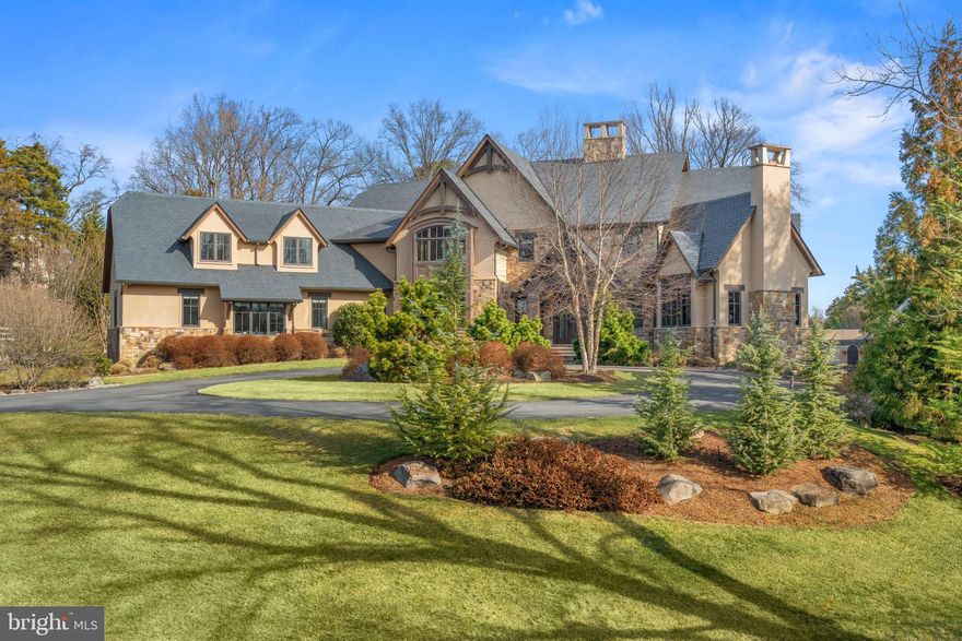 An unbelievable opportunity to own a one-of-a-kind estate on TWO PRIVATE ACRES in Potomac!  This Aspen-inspired showstopper offers a MAIN HOUSE, a carriage-style GUEST HOUSE, a POOL HOUSE, and a spectacular SUBTERRANEAN GARAGE.  A visionary collaboration between award winning architect Mark Sullenberger and interior designer Barry Dixon, every inch of this 7 bedroom, 8 full and 3 half bath home speaks to the highest level of craftsmanship, from stunning walnut and travertine floors, reclaimed wood beams, soaring vaulted and cathedral ceilings, oversized cased windows and French doors, to exquisite finishes and custom millwork throughout. Spanning over 14,000 finished square feet, the open-concept design seamlessly integrates grand entertaining spaces with warm, intimate gathering areas suitable for any family size.  A dramatic two-sided fireplace welcomes you into the expansive living room, offering terrace access and sweeping views of the lushly landscaped grounds. The chef’s kitchen, a true showpiece, features Premier Custom Cabinetry, top-of-the-line appliances, a bright breakfast area, and an inviting family lounge. A formal dining room with an adjoining caterer’s kitchen, two home offices, a billiards room with a custom full wet bar, a functional mudroom with built-in lockers, and two powder rooms complete the main level.  The upper level is centered around a magnificent primary suite with a spa-inspired bath, two dressing closets - one with a private loft, two water closets, and a secluded balcony. Four additional ensuite bedrooms and a well-appointed laundry/luggage room upstairs ensure every detail is designed for comfort and convenience. The lower level is a recreational dream, boasting a vast family/game room, a state-of-the-art home theater with tiered seating and wet bar, a fully equipped fitness and wellness room with walk-out access to a dedicated patio, and an in-law suite with kitchenette and laundry. For those seeking multigenerational living options, the carriage-style guest house offers a cozy living area, spacious bedroom, full kitchen and bath, laundry and a three-car garage. Car enthusiasts will marvel at the commercial-grade, subterranean garage, an architectural rarity designed to showcase a collection of 7+ vehicles.  The outdoor oasis rivals a luxury resort, featuring a heated saltwater pool and spa, a pool house with a kitchenette and NanaWall sliding glass, a pavilion dining area, a full cabana bath, a gas fire pit, and a lighted sport court. Professionally designed landscaping beautifies the grounds with an abundance of mature specimen trees and plantings, complemented by integrated Sonos and illumination.  Sophisticated smart home technology includes Lutron dimmable lighting, Sonos central sound, and upgraded security systems.  To further enhance the efficiency, functionality and aesthetics, the house is equipped with multi-zoned Geothermal HVAC, wired and outfitted for an elevator and a whole house generator, and gate roughed-in for gas lanterns, electric and communications.  The  property is ideally located less than two miles from the Capital Beltway offering effortless access to the Washington Metropolitan’s vibrant social, sports and cultural scene, three international airports, exceptional public and private schools, and prestigious country clubs.  Seller has made many improvements since ownership presenting a move-in ready opportunity to own a truly distinctive residence with an unmatched lifestyle – an exquisite sanctuary you may never wish to leave.