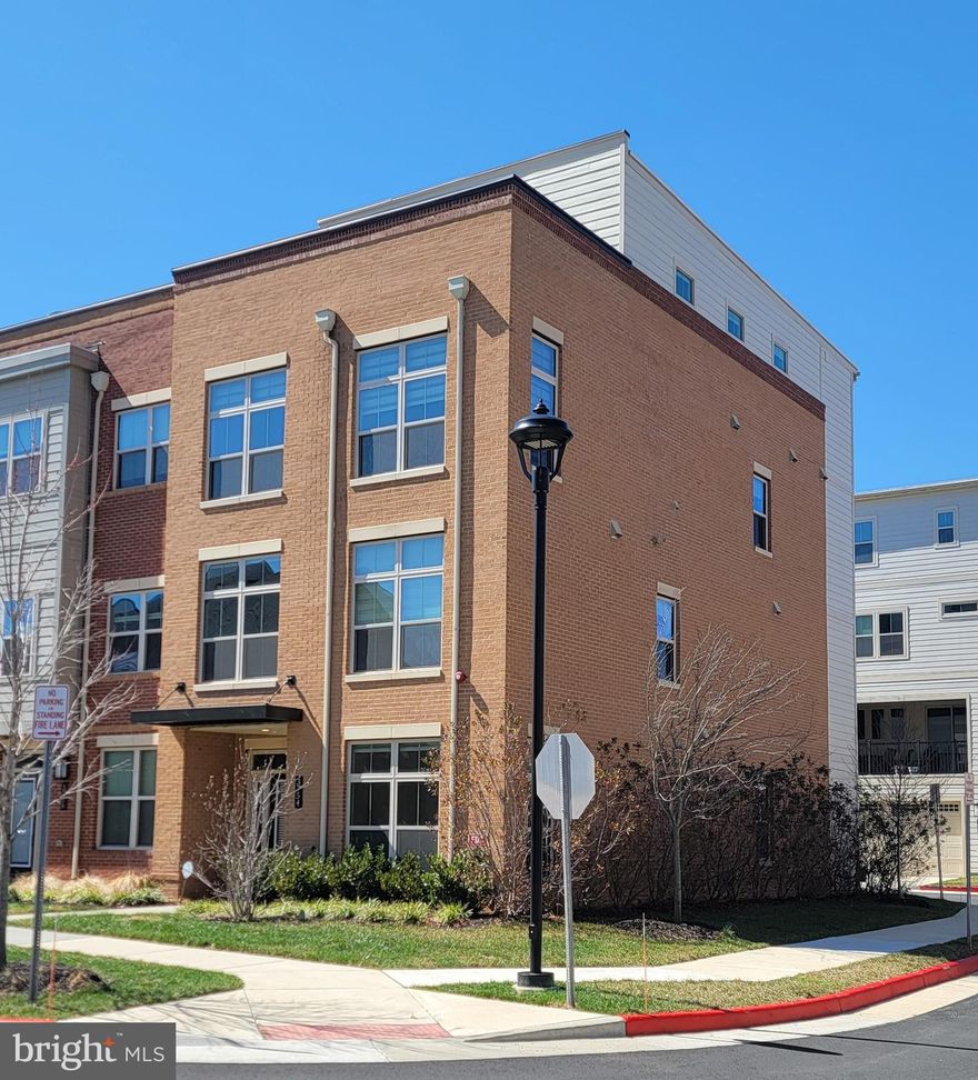 GREAT LOCATION!     Largest Model  in the Community w/  3,390 SF.   (4 FLOORS)   Luxury  Brick Front , 4 Bed Rm, 4 Full & 1 Half Bath End-Unit Townhome  is in One of the Most Sought-After  Areas  of Fairfax City.   This  Stunning 4 Level  Unit has 2 Car Garage & two Balconies.    Gourmet Kitchen w/ Stainless Steel Appliances, Farmhouse Sink  & Soft-Close Cabinetry.   Huge Center Island w/ Upgraded Silestone Quartz Countertops.   Kitchen/Dining Leading out to Private    Covered Patio w/  Upgraded Wall Fireplace.   Impressive  Open & Modern Living Rm & Souring Ceilings   is included in this Home that Boasts over $20,000 in Upgrades.     Upstairs is  the Luxurious Owner's Suite w/ Tray Ceilings, Two Huge Walk-In Closets & Luxurious  En-Suite Bath w/ Silestone Quartz Countertops, Glass-Enclosed Shower & Upgraded Soaking Tub.     Generously Sized Two Other Bedrooms  & Baths.    Fourth Level has a Recreation Room,  4th Bedroom w/ Walk-In Closet & Full Bath.  Rec Rm  w/ Walk-Out to Rooftop Terrace.    Conveniently located to Shopping , Dining,  Entertainment, Schools,  Parks,  Major Commuter Routes, a Metro Station & Washington DC.       MUST SEE!